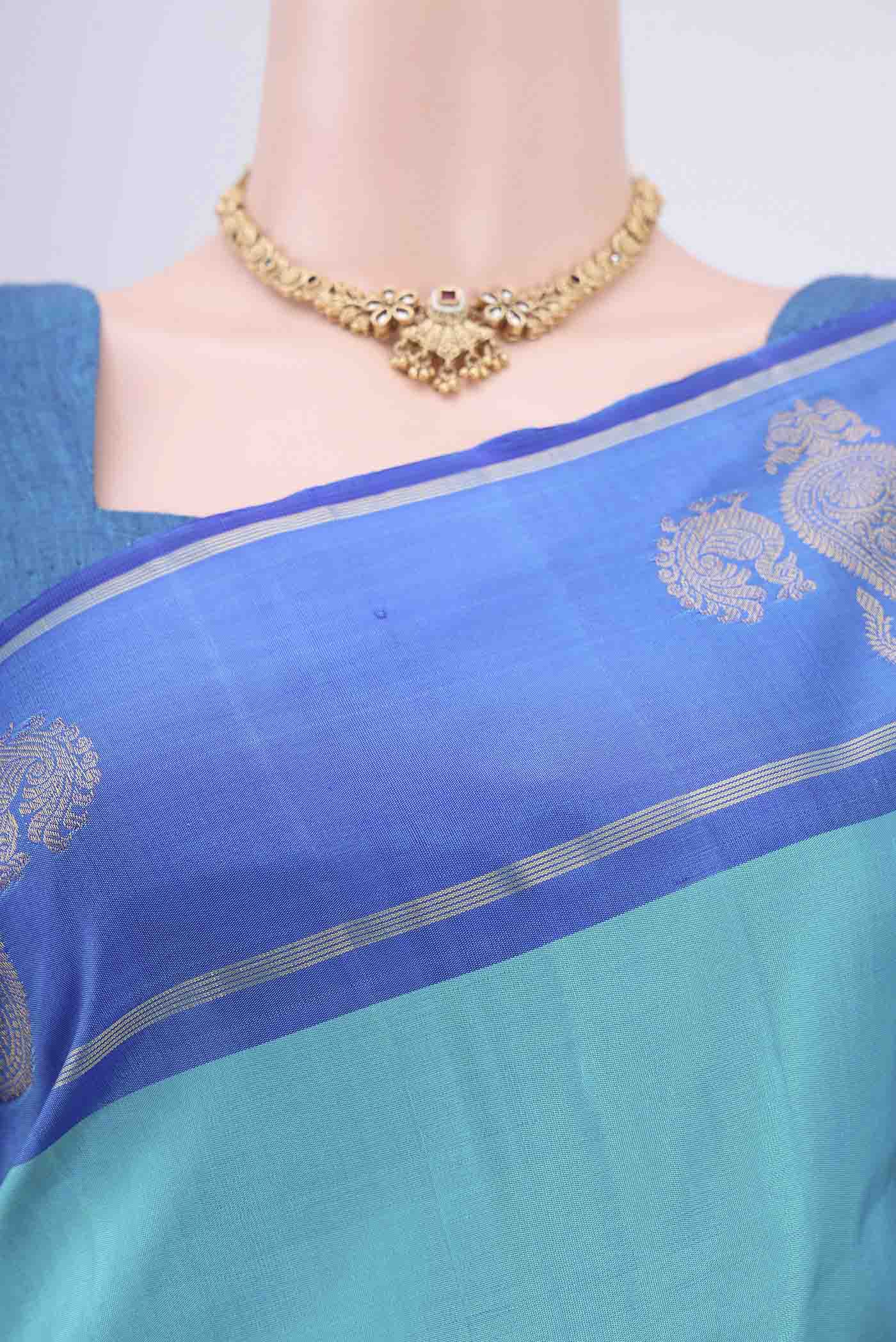 Border image of Turquoise Kanchipuram Silk Saree with Plain Body and Zari Border. 
