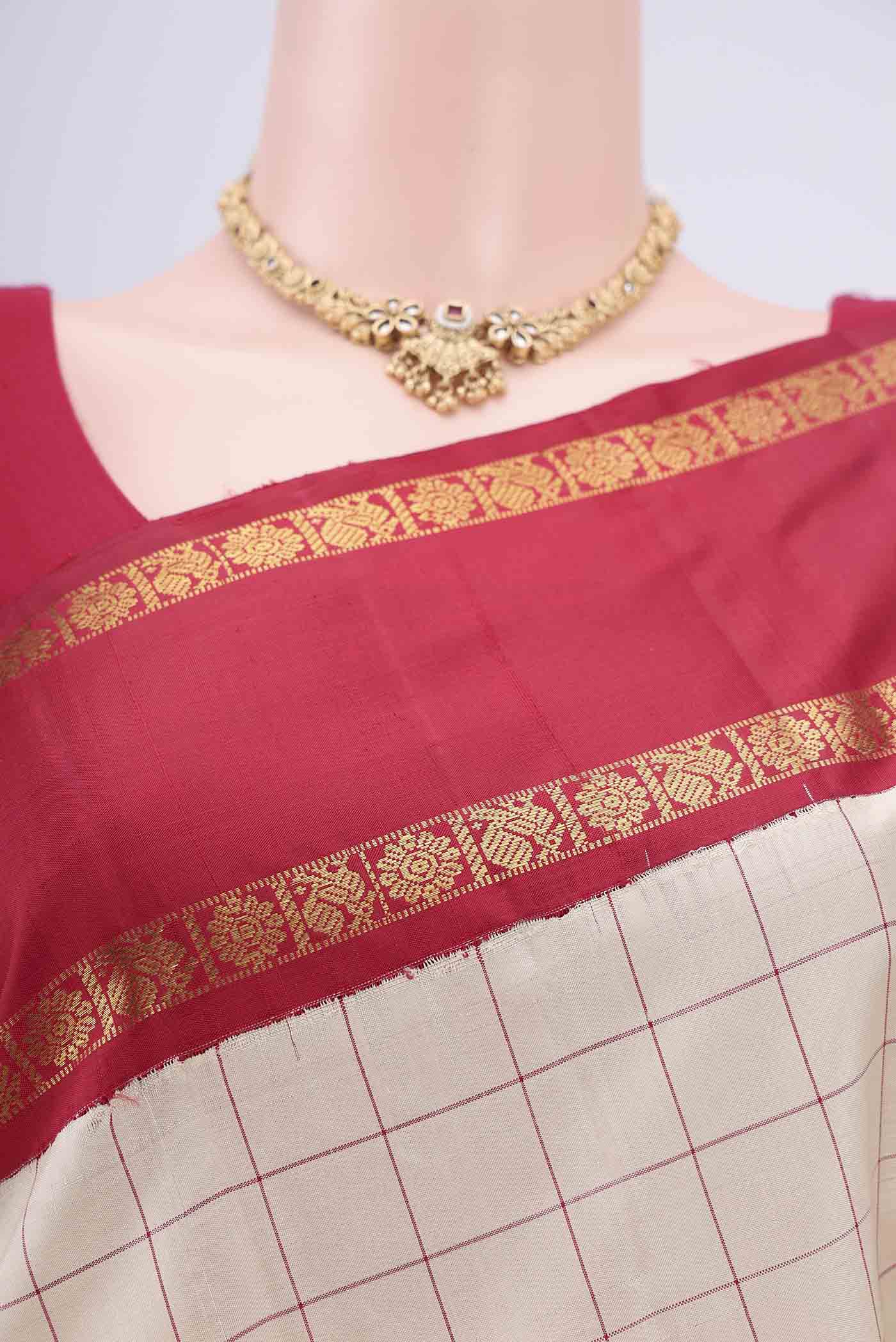 Border image of Off White Kanjivaram Silk Saree with Checked design on the body and Zari Border. 