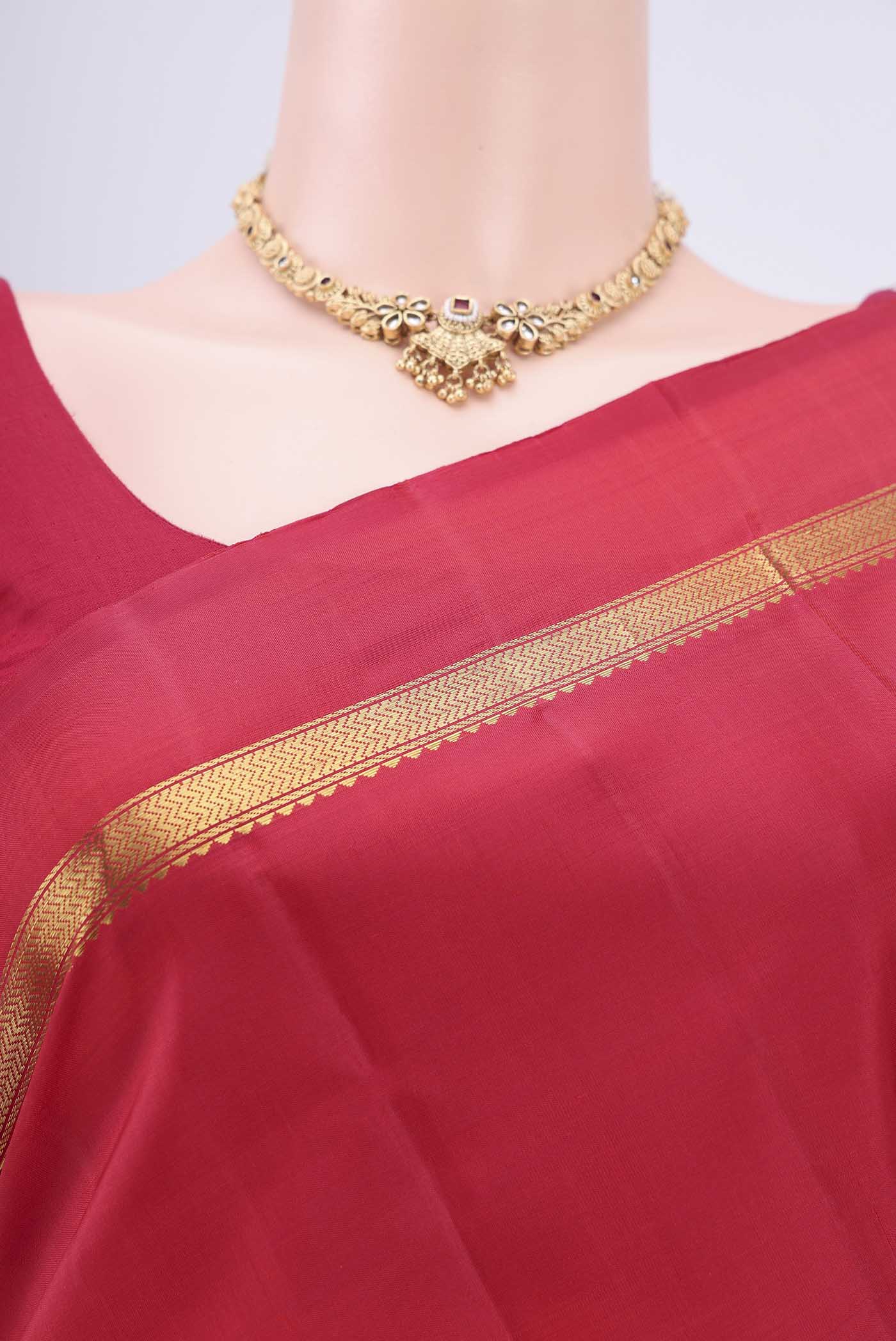 Border image of Maroon Kanjivaram Silk Saree with Plain Body and Zari Border. 