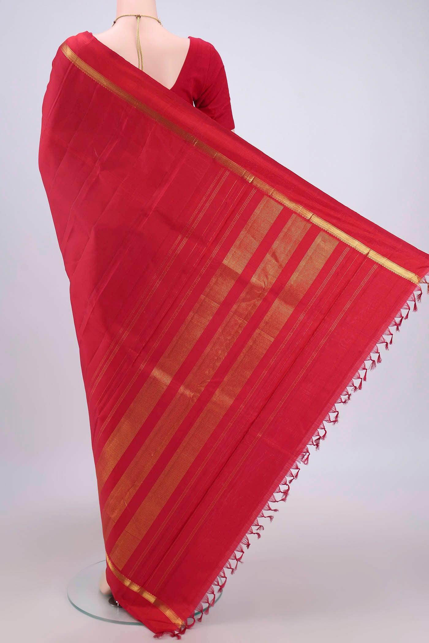 Flat view of Maroon Kanjivaram Silk Saree with Plain Body and Zari Border. 