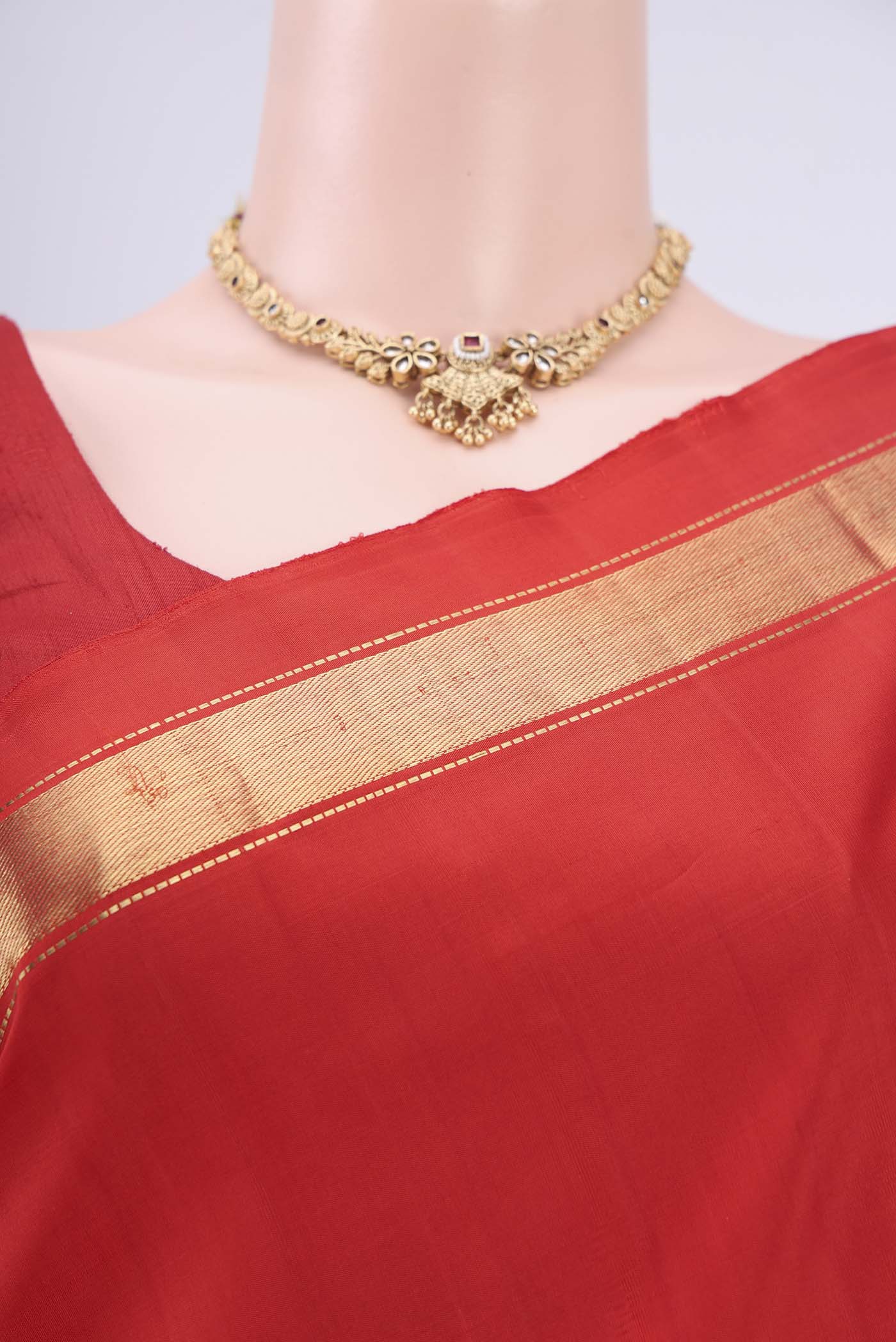 Border image of Red Dual Tone Kanjivaram Silk Saree with Plain Body and Zari Border. 