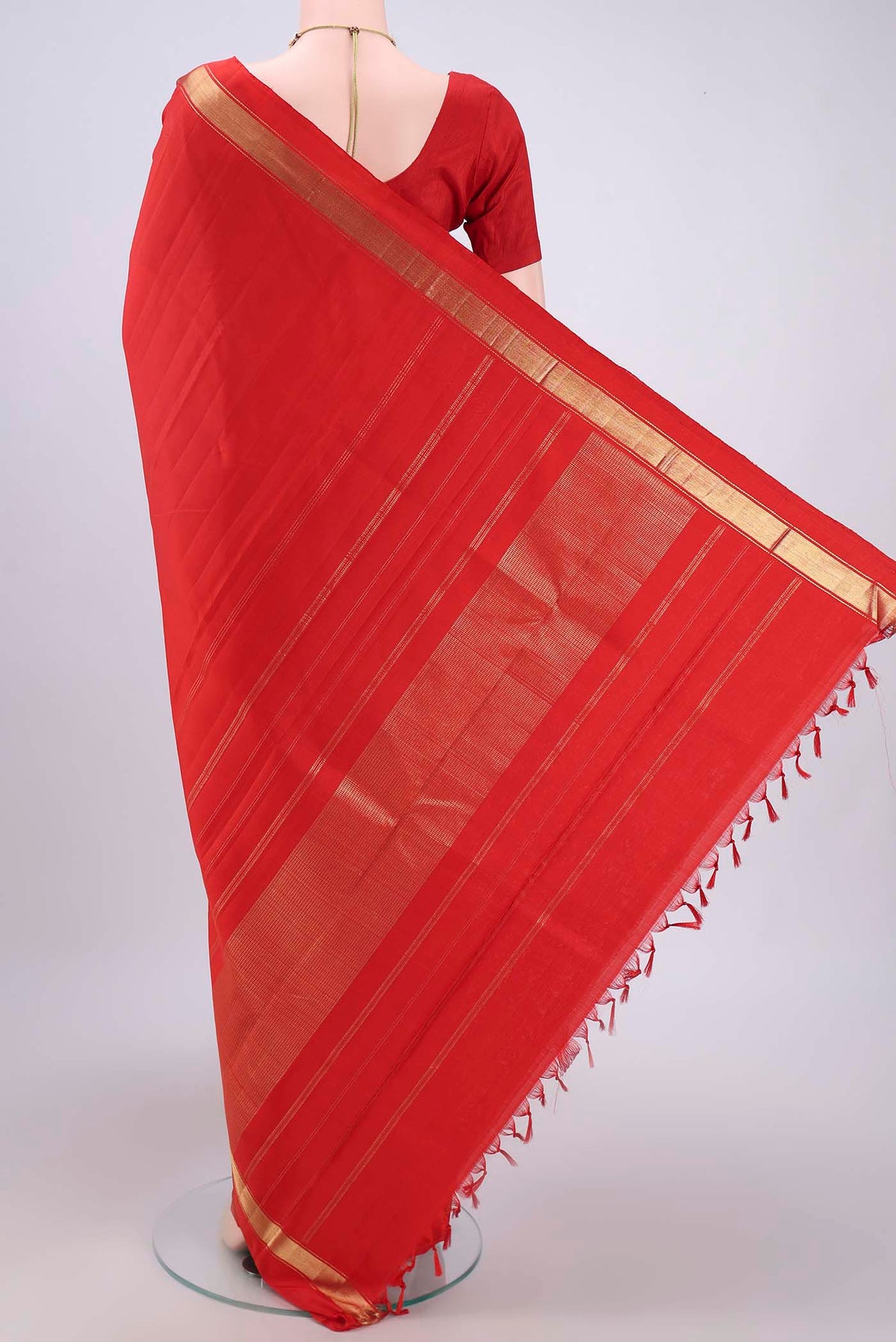 Flat view of Red Dual Tone Kanjivaram Silk Saree with Plain Body and Zari Border. 