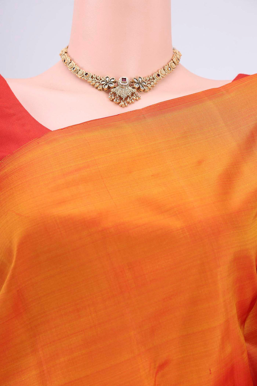 Border image of Brick Orange Kanchipuram Saree with Plain Body and Rising Temple Border. 