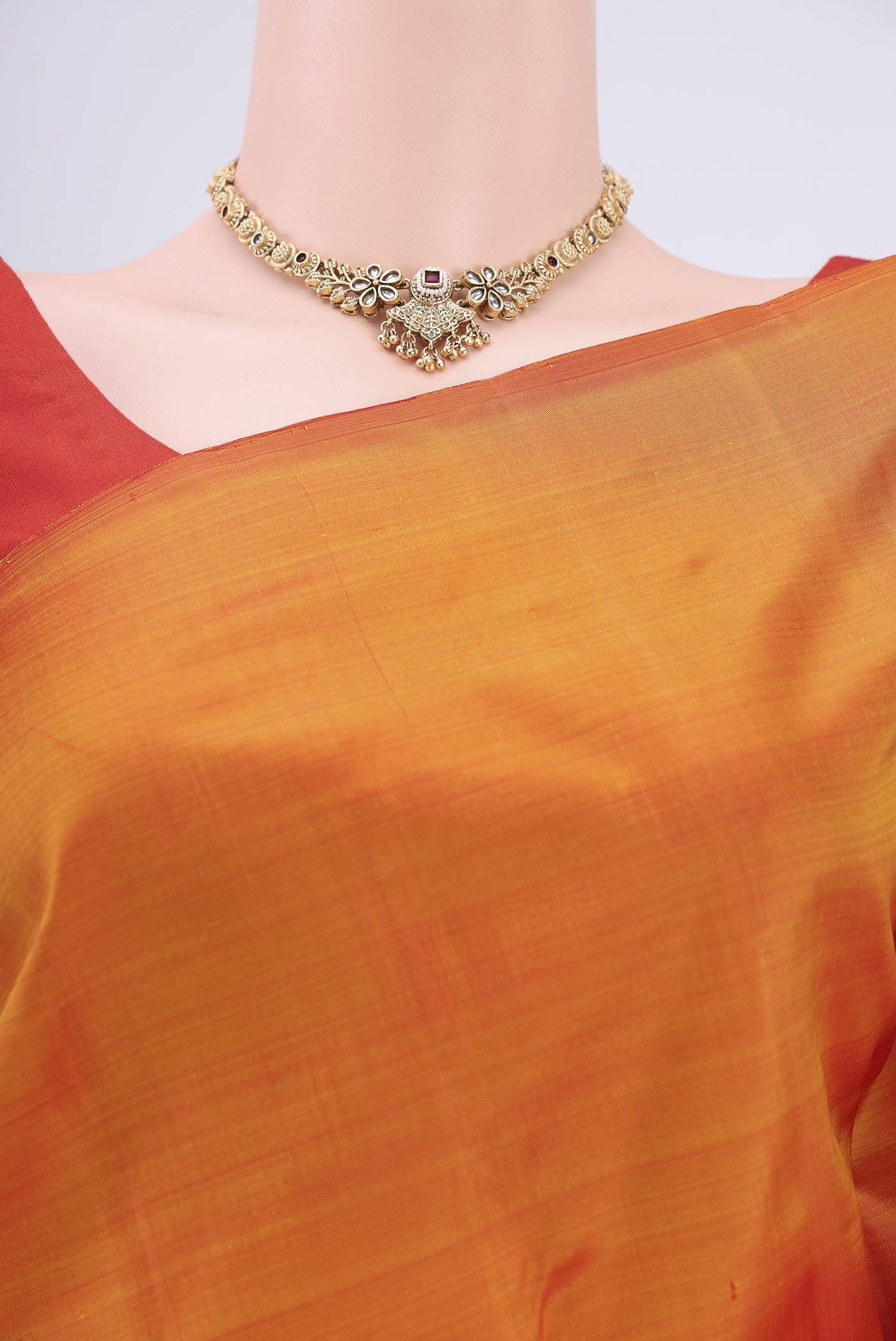 Border image of Brick Orange Kanchipuram Saree with Plain Body and Rising Temple Border. 