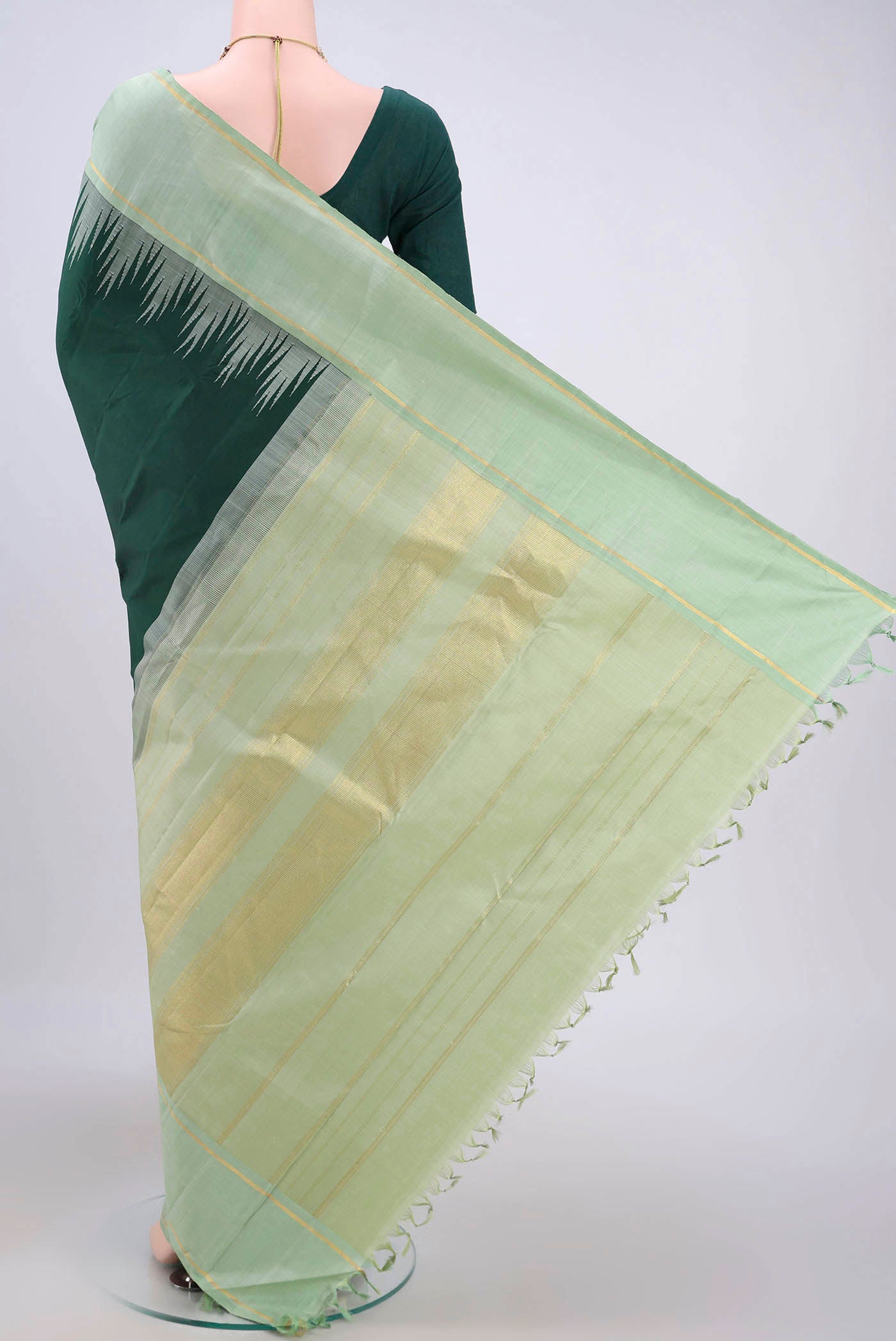 Flat view of Bottle Green Kanjivaram Silk Saree with Plain Body and Temple Border. 