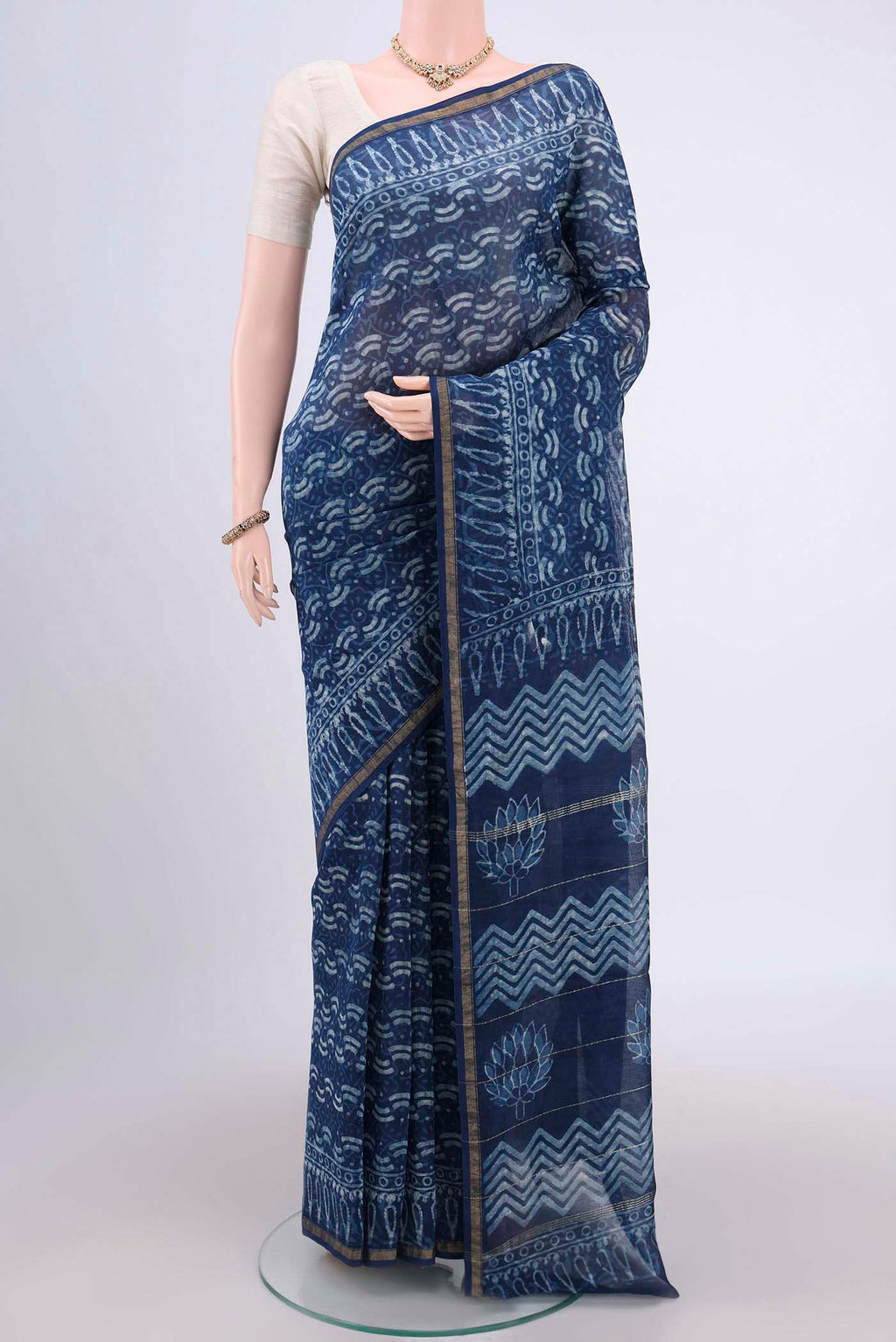 Indigo Maheshwari Silk Cotton Saree with Printed design on the body and Thin Zari Line.  displayed on a mannequin