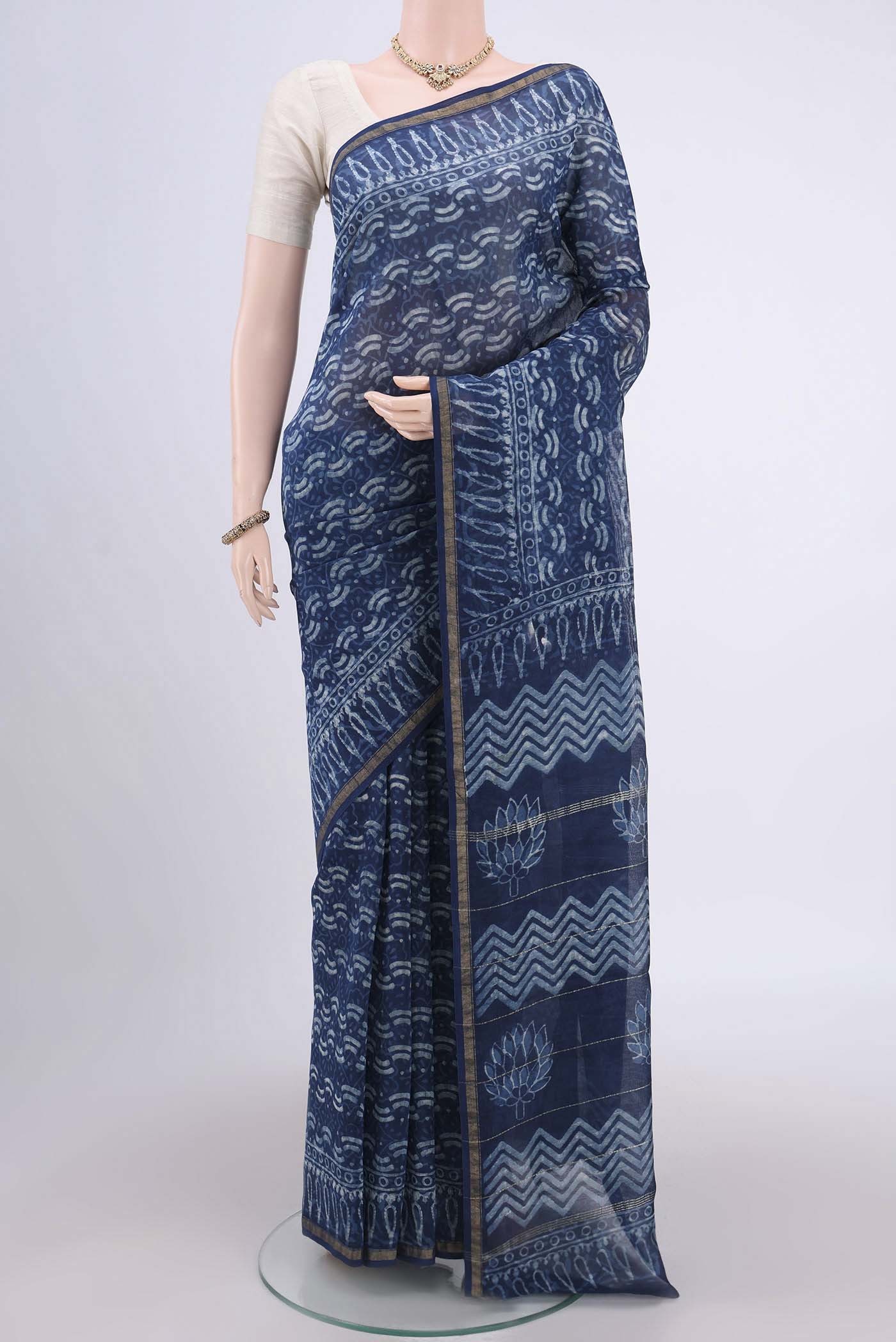 Indigo Maheshwari Silk Cotton Saree with Printed design on the body and Thin Zari Line.  displayed on a mannequin