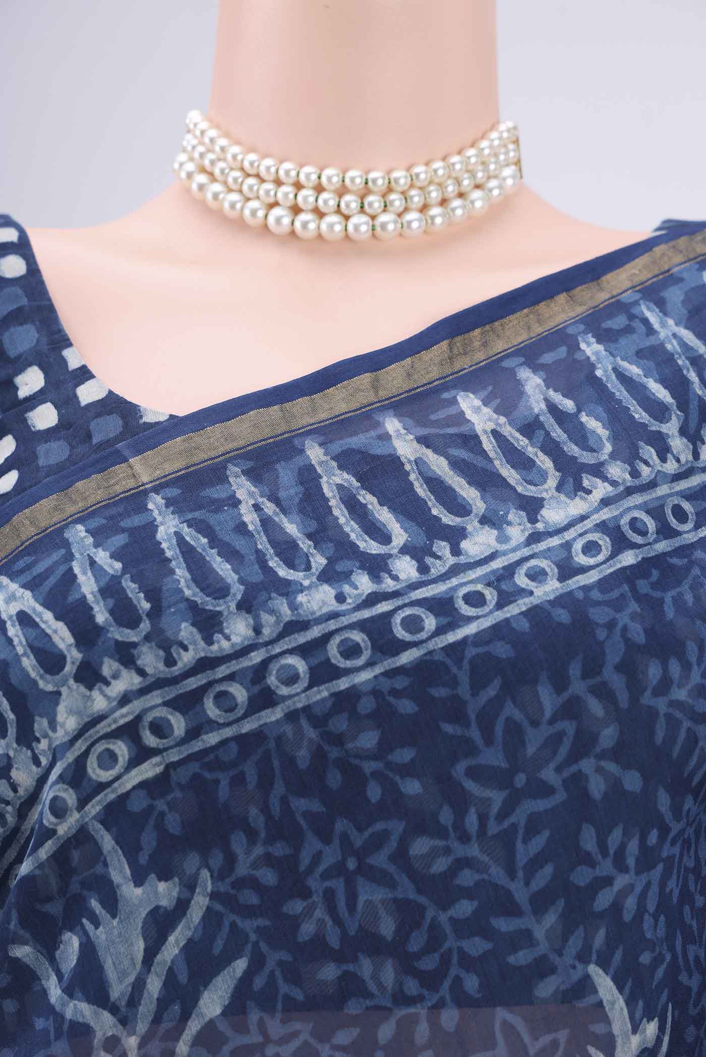Border image of Indigo Maheshwari Silk Cotton Saree with Batik Print on the body and Zari Border. 