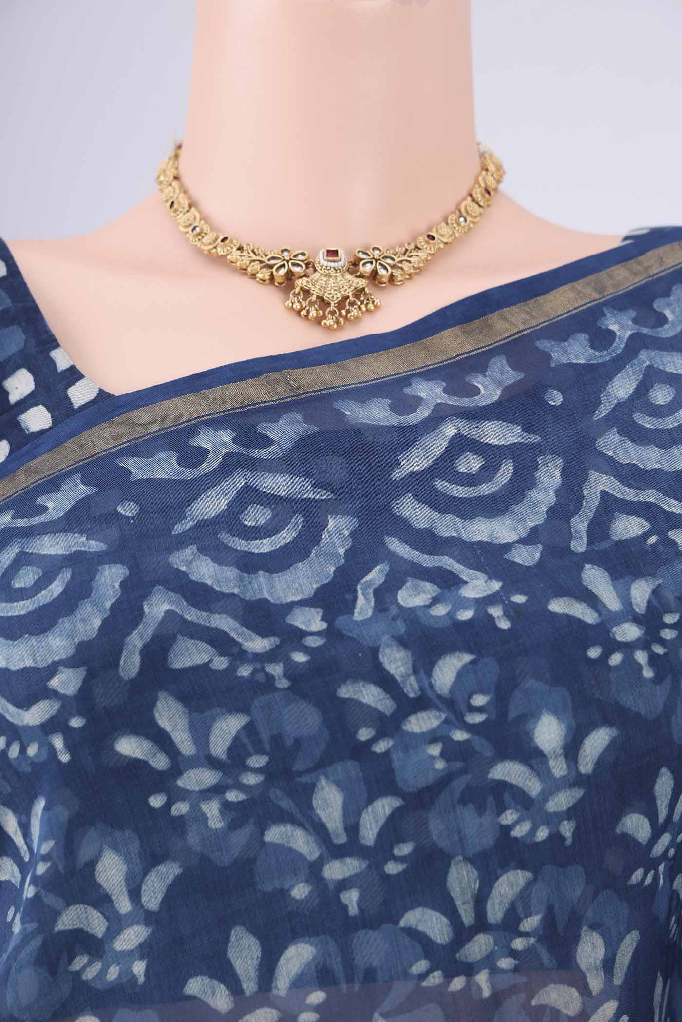 Border image of Indigo Maheshwari Silk Cotton Saree with Batik Print on the body and Zari Border. 