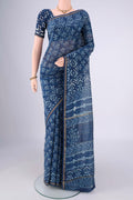 Indigo Maheshwari Silk Cotton Saree with Batik Print on the body and Zari Border.  displayed on a mannequin