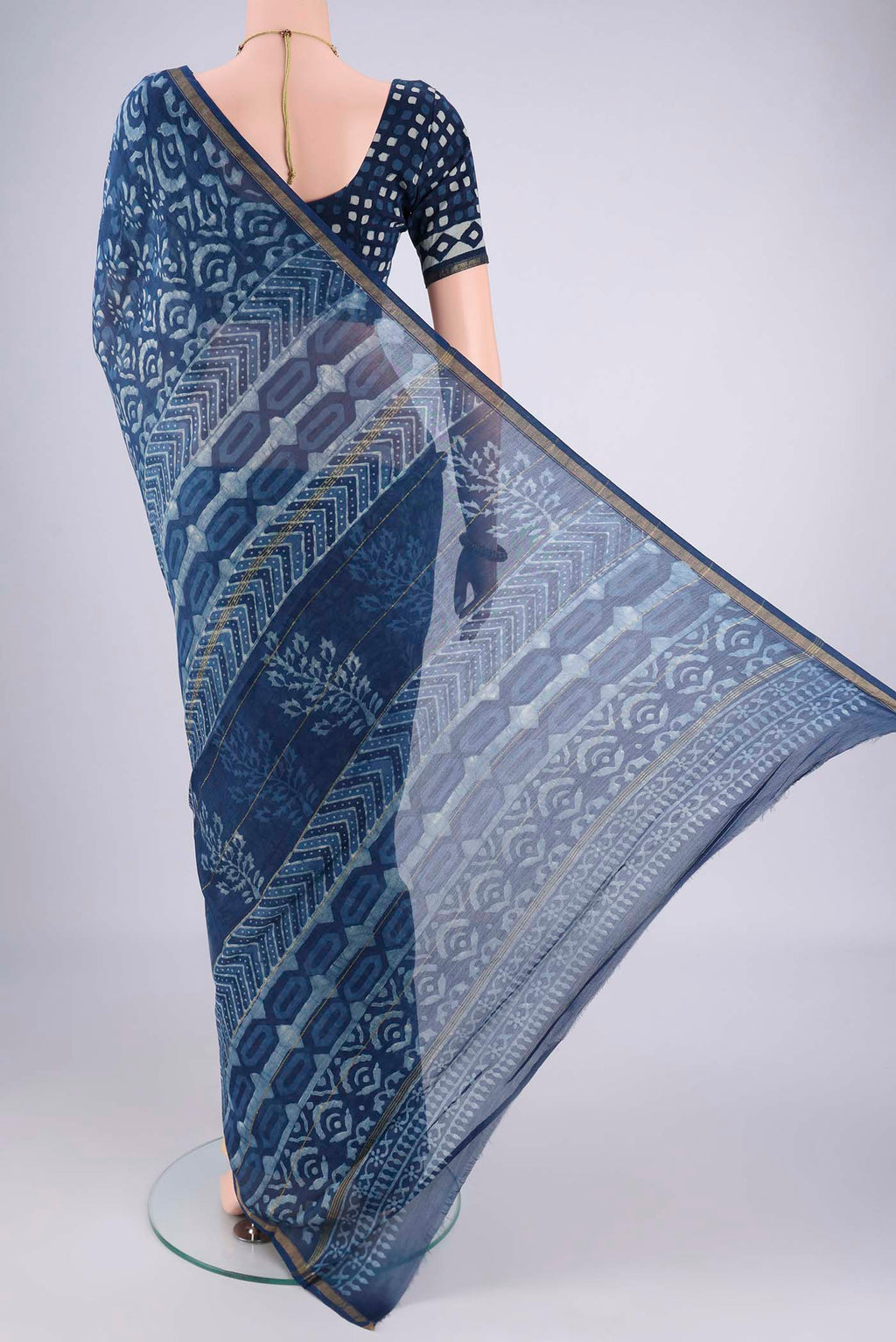 Flat view of Indigo Maheshwari Silk Cotton Saree with Batik Print on the body and Zari Border. 