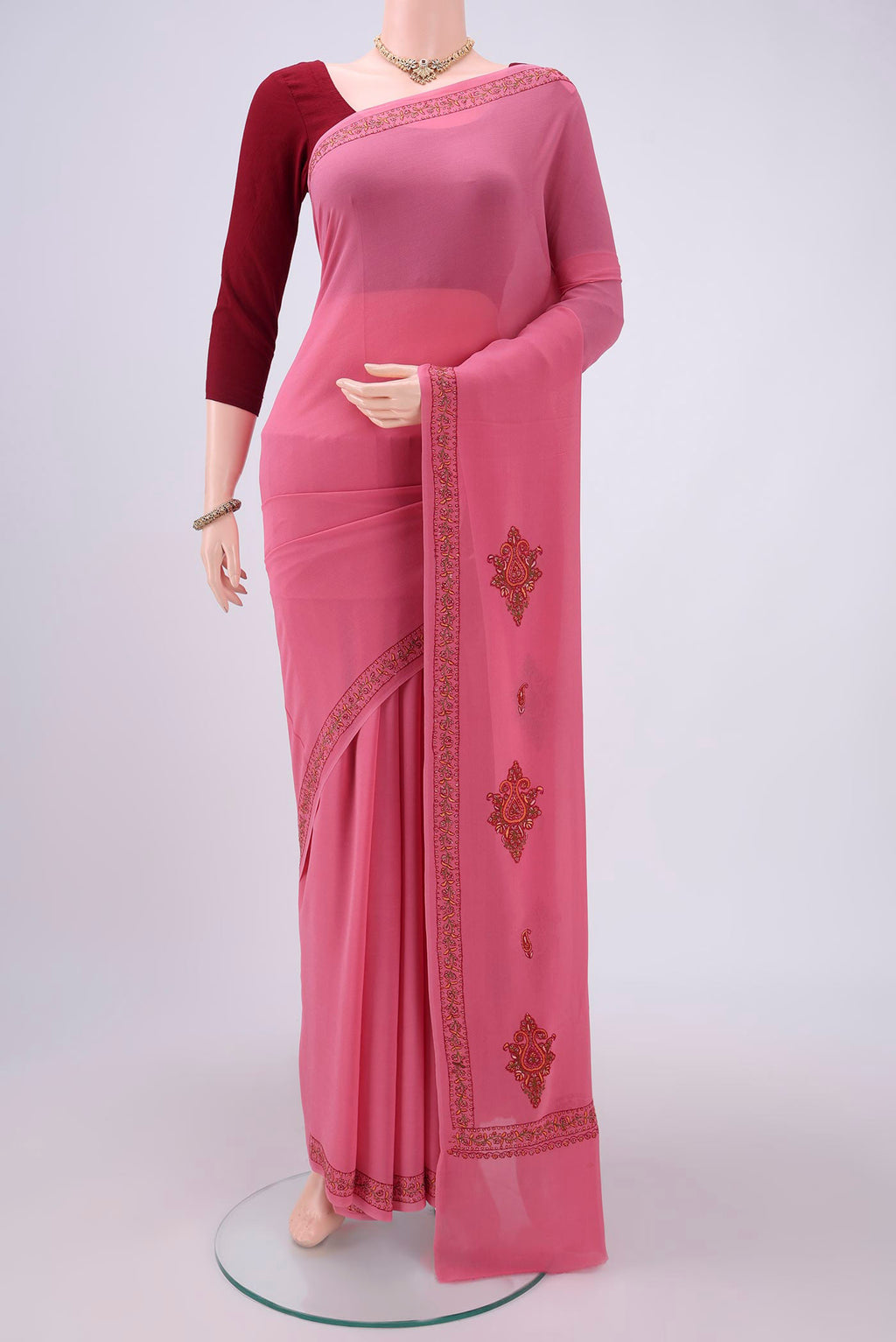 Pink Kashmiri Saree with Plain Body and Thread Border.  displayed on a mannequin