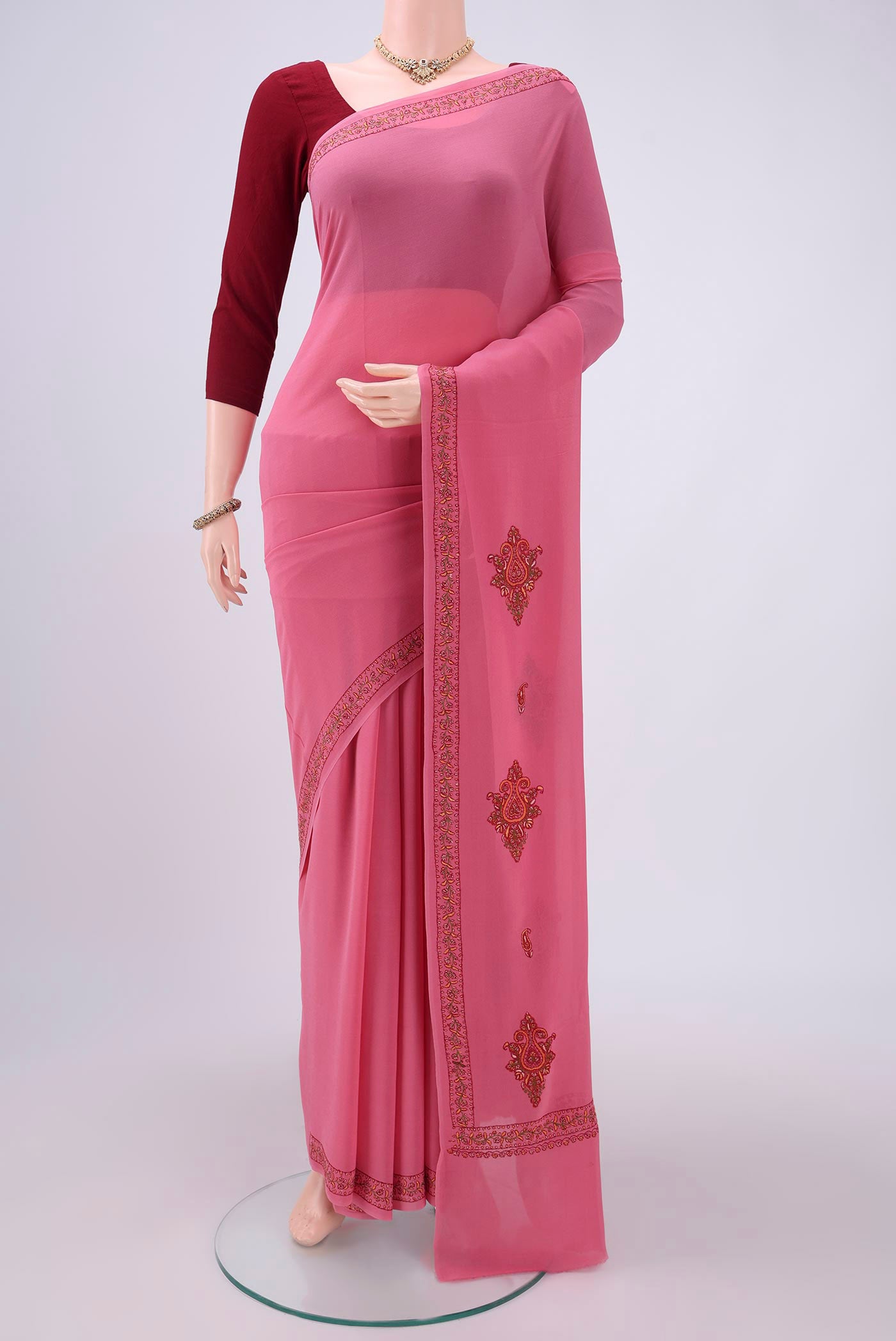 Pink Kashmiri Saree with Plain Body and Thread Border.  displayed on a mannequin