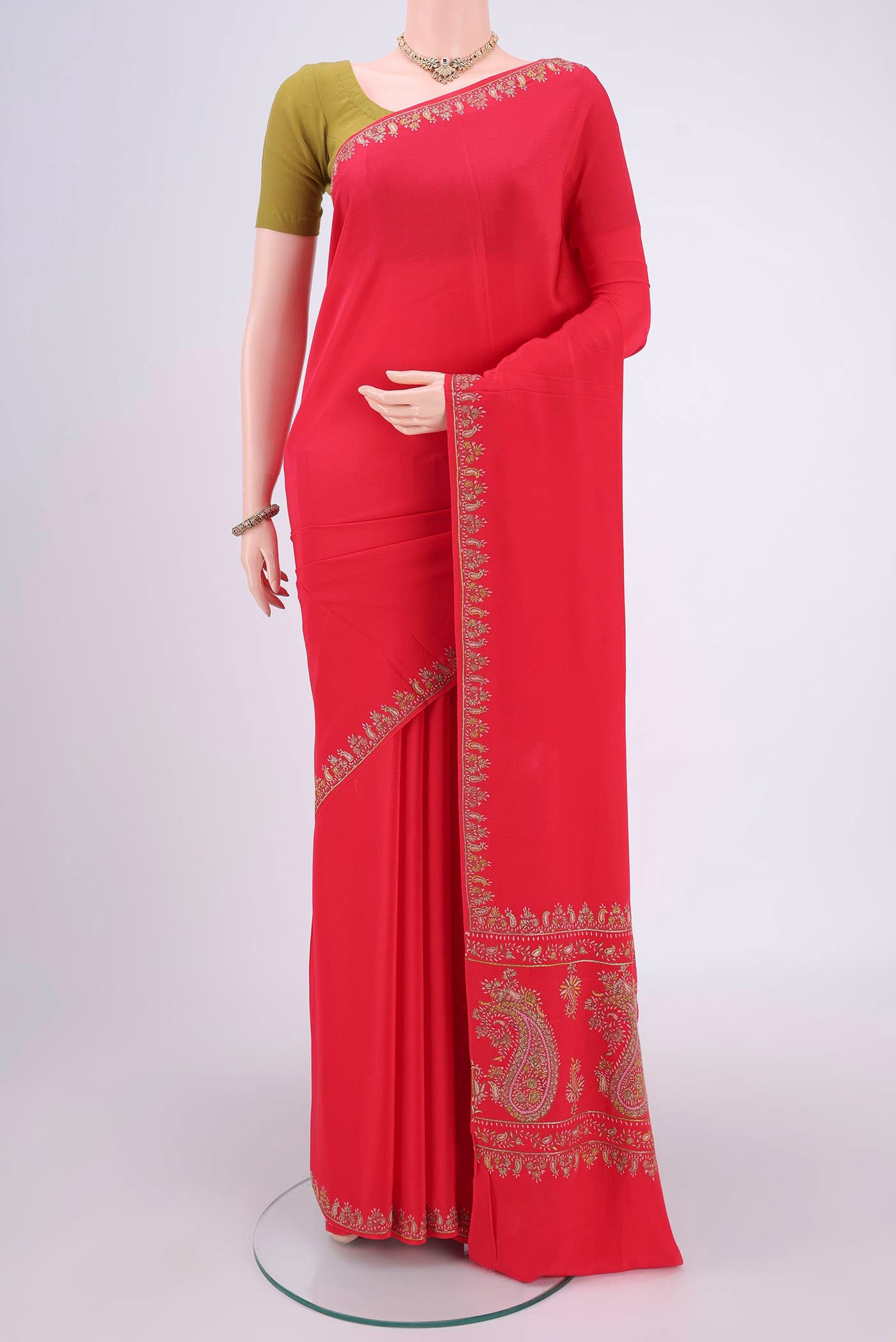 Red Kashmiri Saree with Plain Body and Thread Border.  displayed on a mannequin