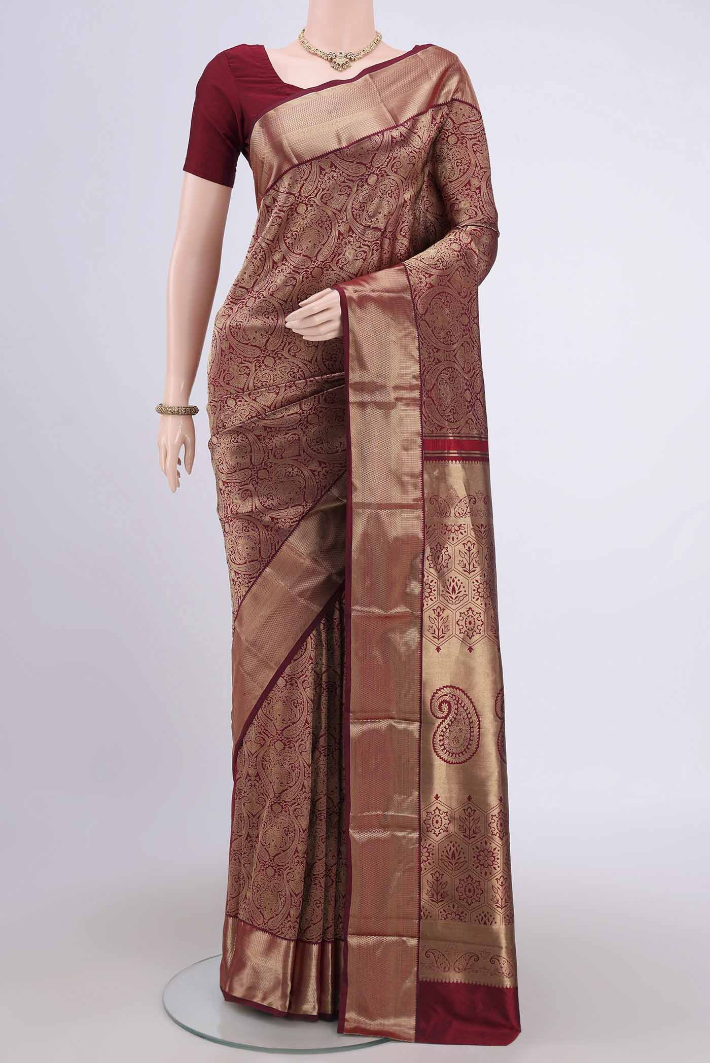 Maroon Bangalore Silk Saree with Zari Brocade on the body and Zari Border.  displayed on a mannequin
