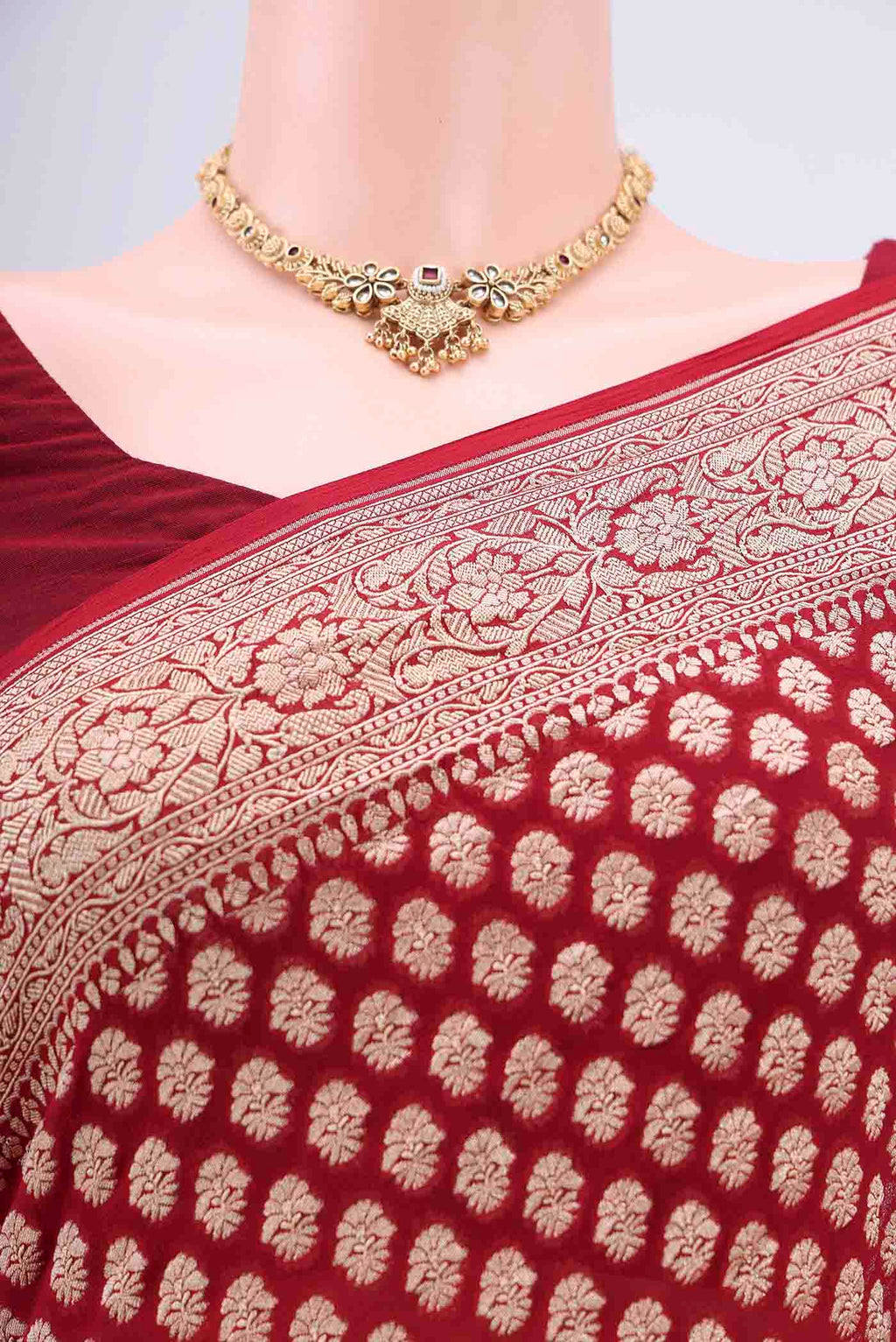 Border image of Maroon Banarasi Georgette Saree with Zari Brocade on the body and Zari Border. 
