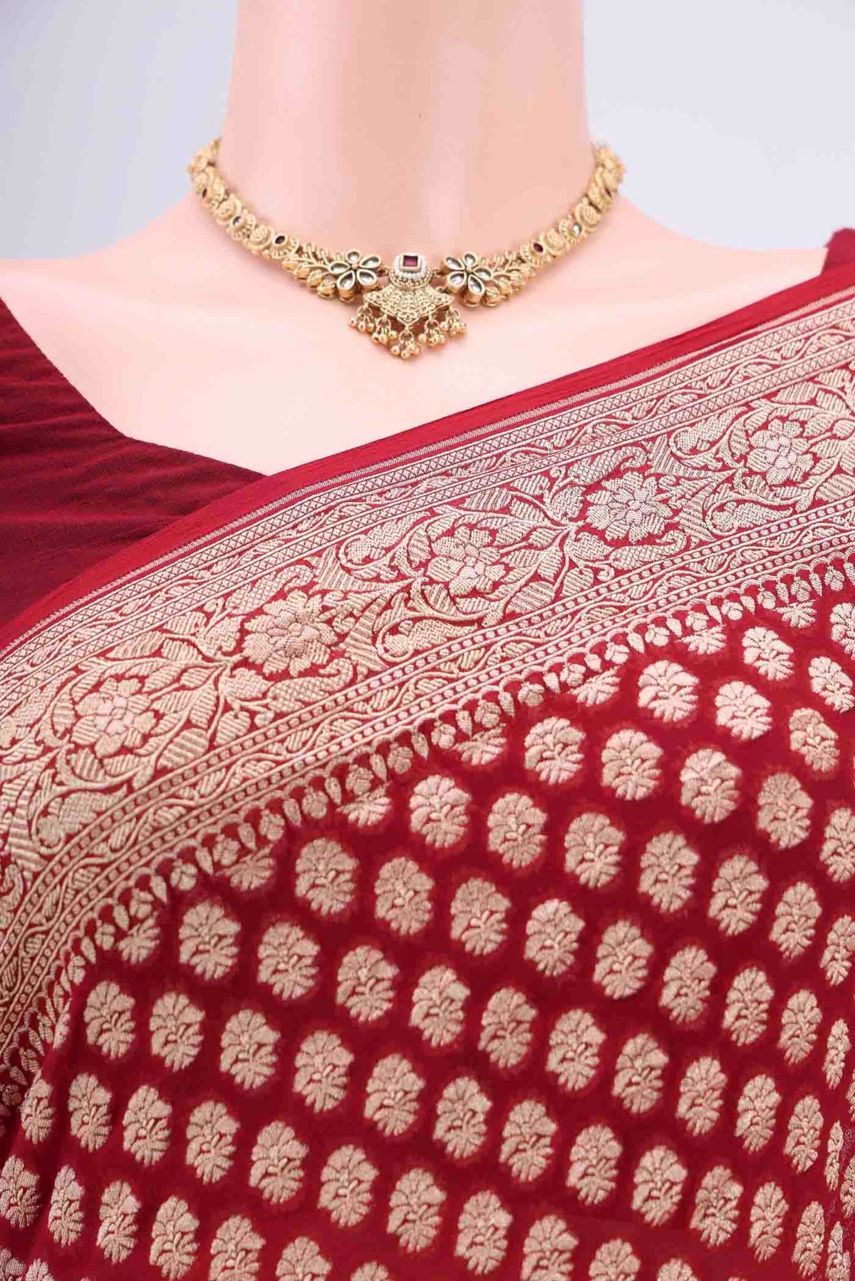 Border image of Maroon Banarasi Georgette Saree with Zari Brocade on the body and Zari Border. 