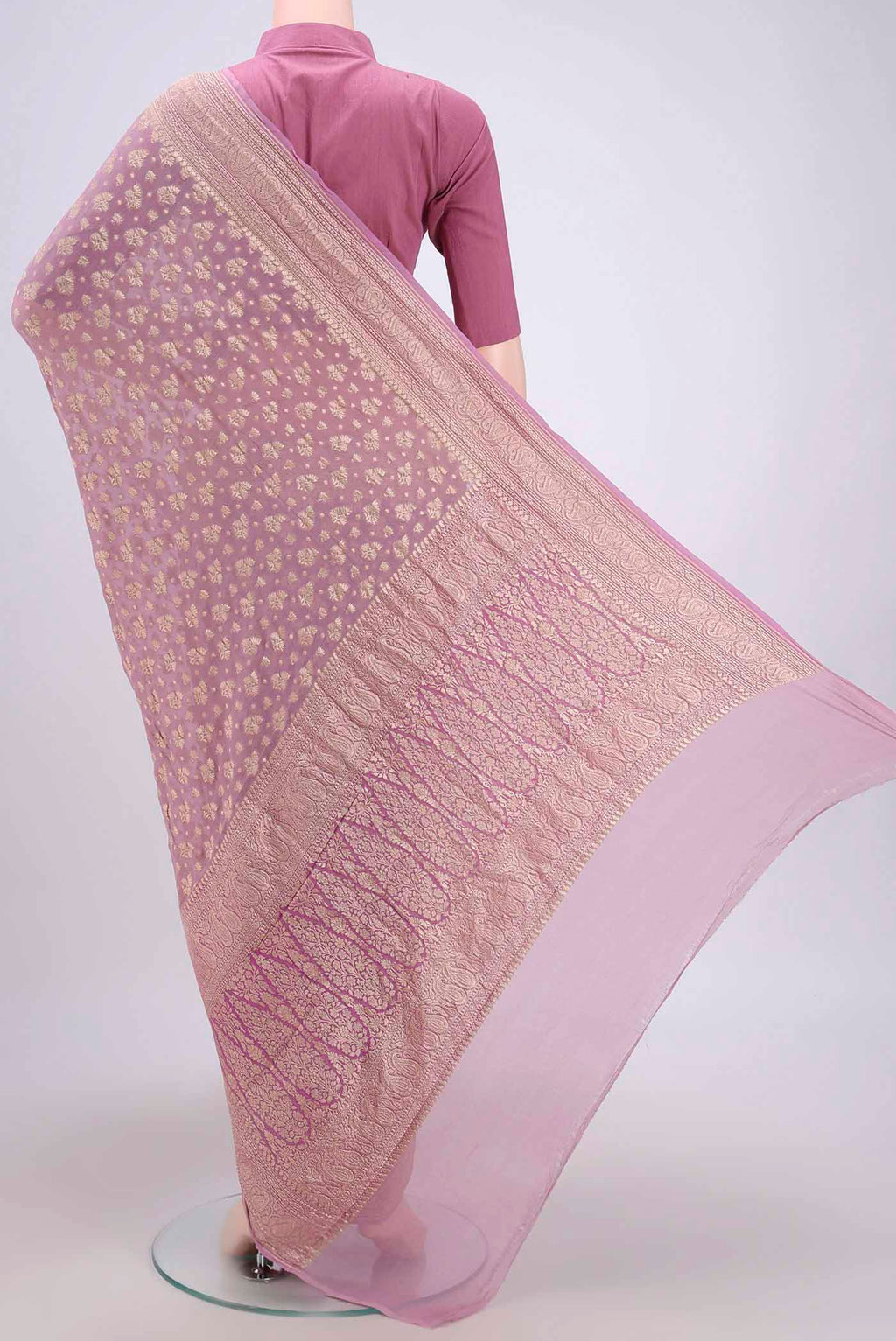 Flat view of Lilac Banarasi Georgette Saree with Zari Brocade on the body and Zari Border. 