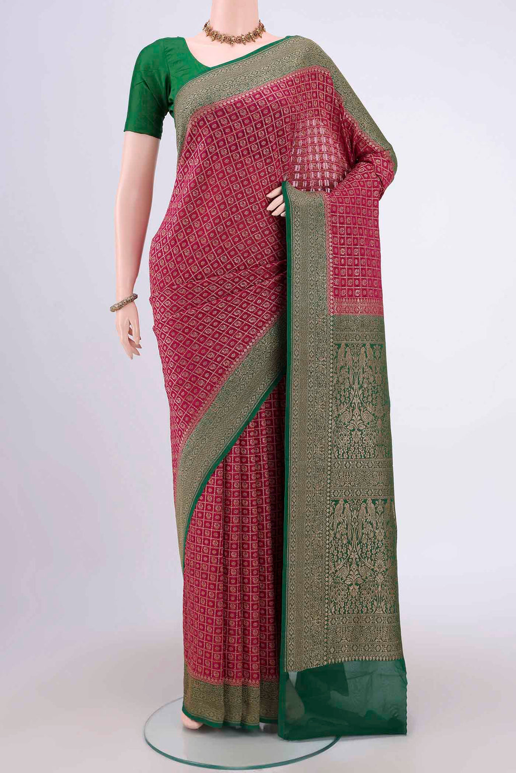 Dark Pink Banarasi Georgette Saree with Checked design on the body and Zari Border.  displayed on a mannequin