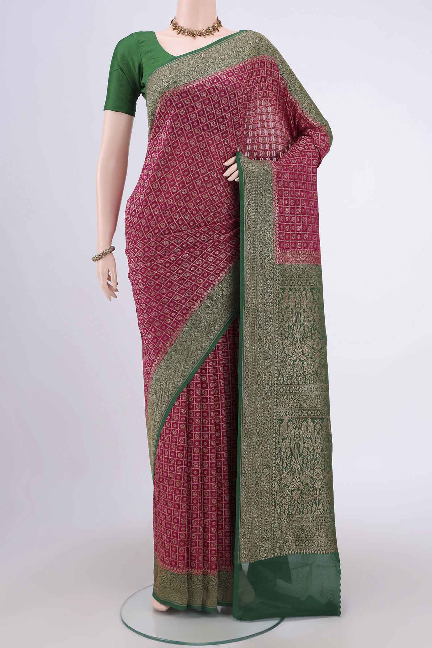 Dark Pink Banarasi Georgette Saree with Checked design on the body and Zari Border.  displayed on a mannequin