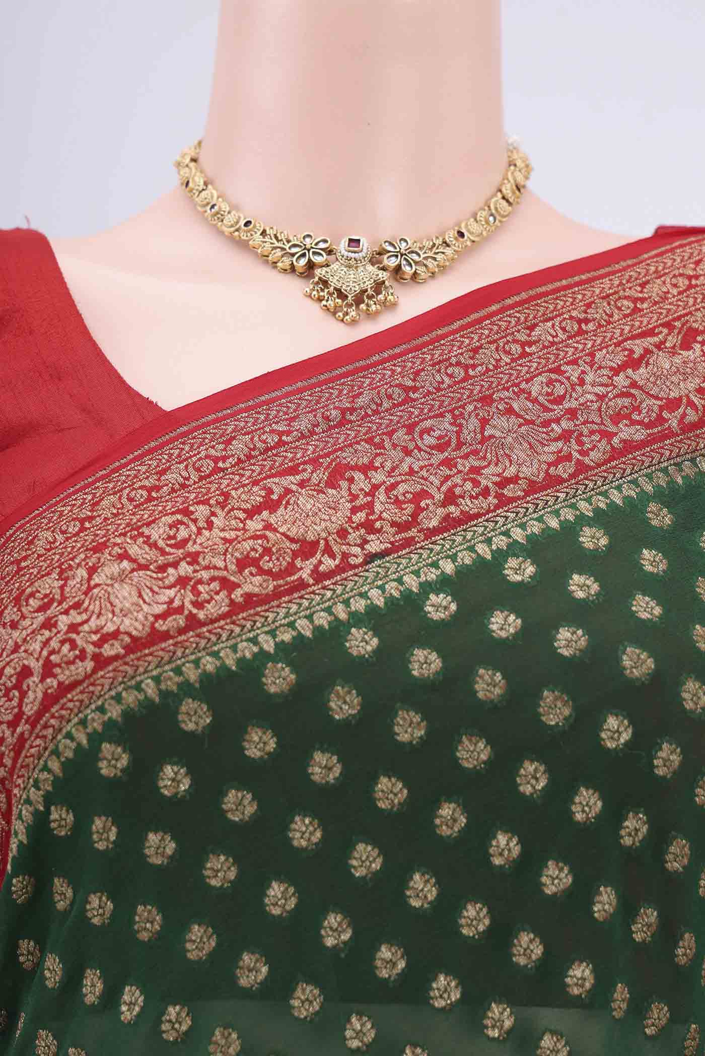 Border image of Bottle Green Banarasi Georgette Saree with Checked design on the body and Zari Border. 