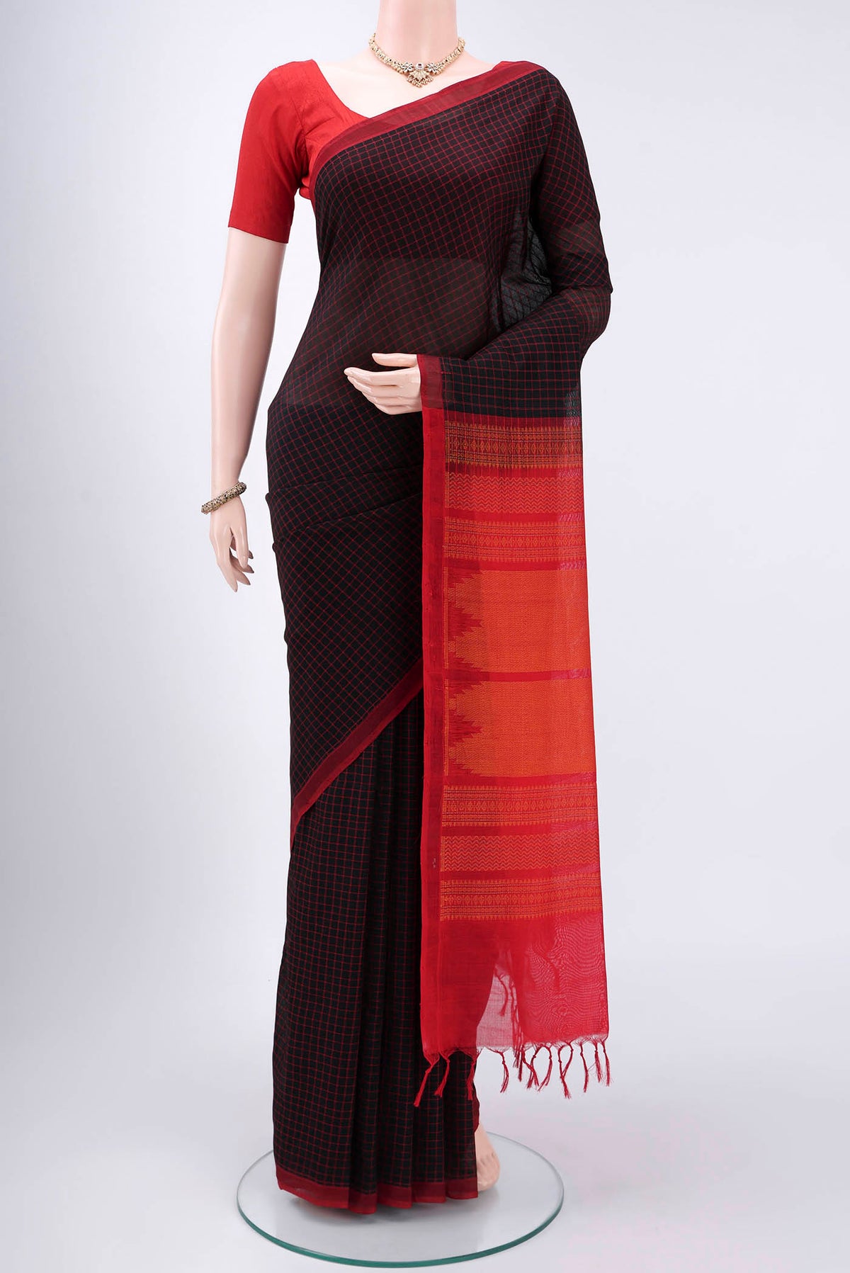 Black Coimbatore Silk Cotton Saree with Checked design on the body and Thread Border.  displayed on a mannequin
