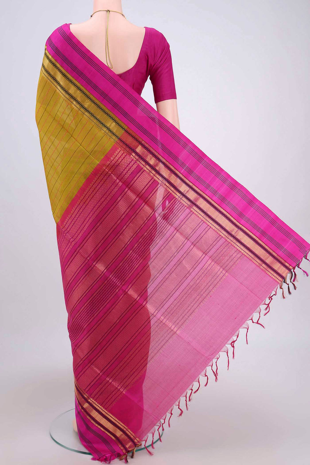 Flat view of Green Coimbatore Silk Cotton Saree with Stripes on the body and Plain Border. 