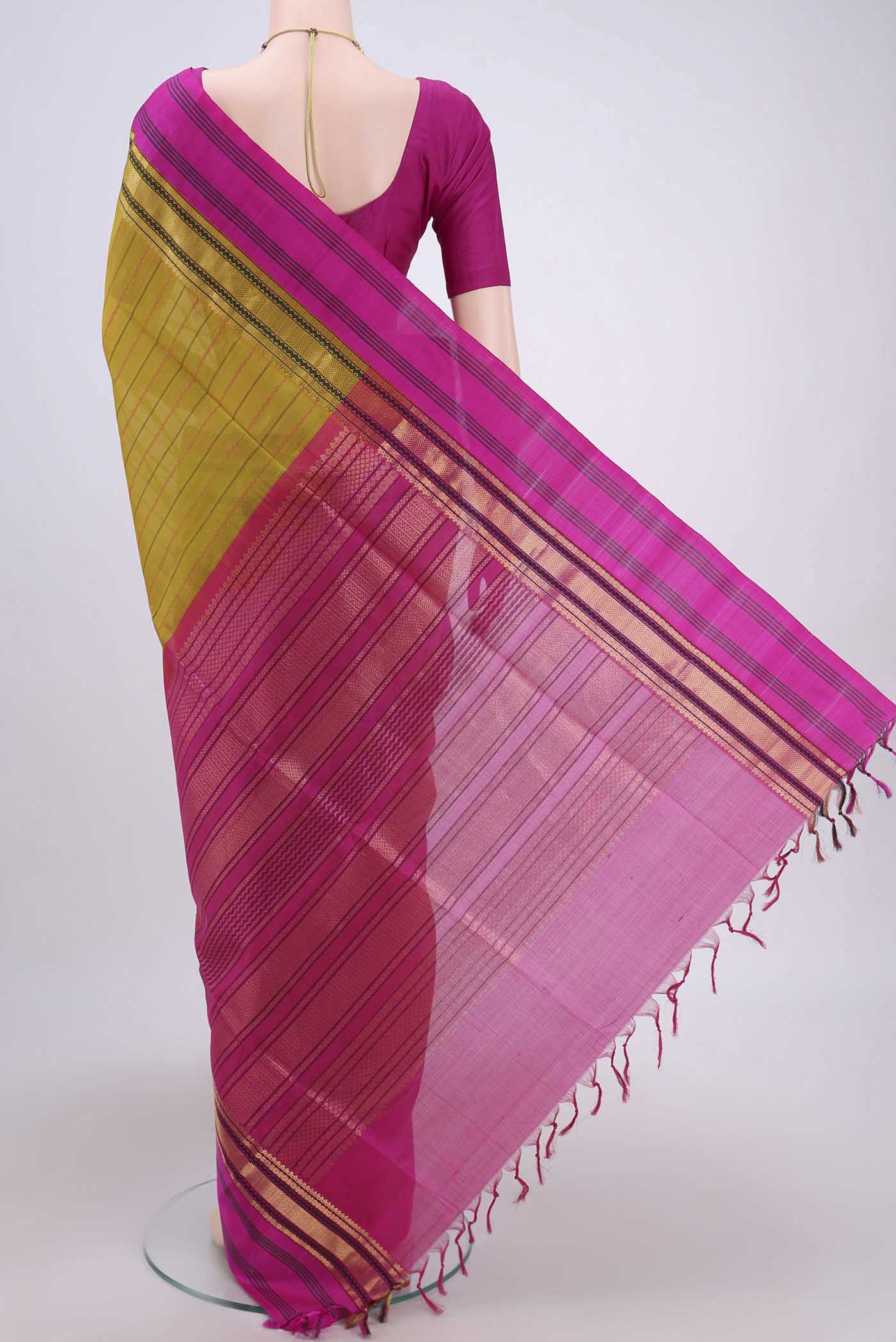 Flat view of Green Coimbatore Silk Cotton Saree with Stripes on the body and Plain Border. 