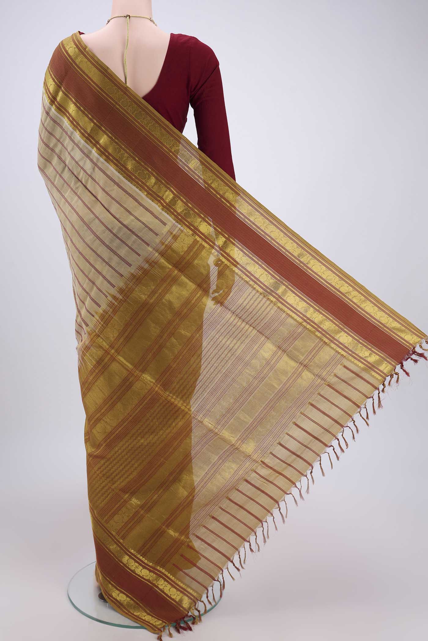 Flat view of Beige Silk Cotton Saree with Veldhari on the body and Zari And Thread Border. 