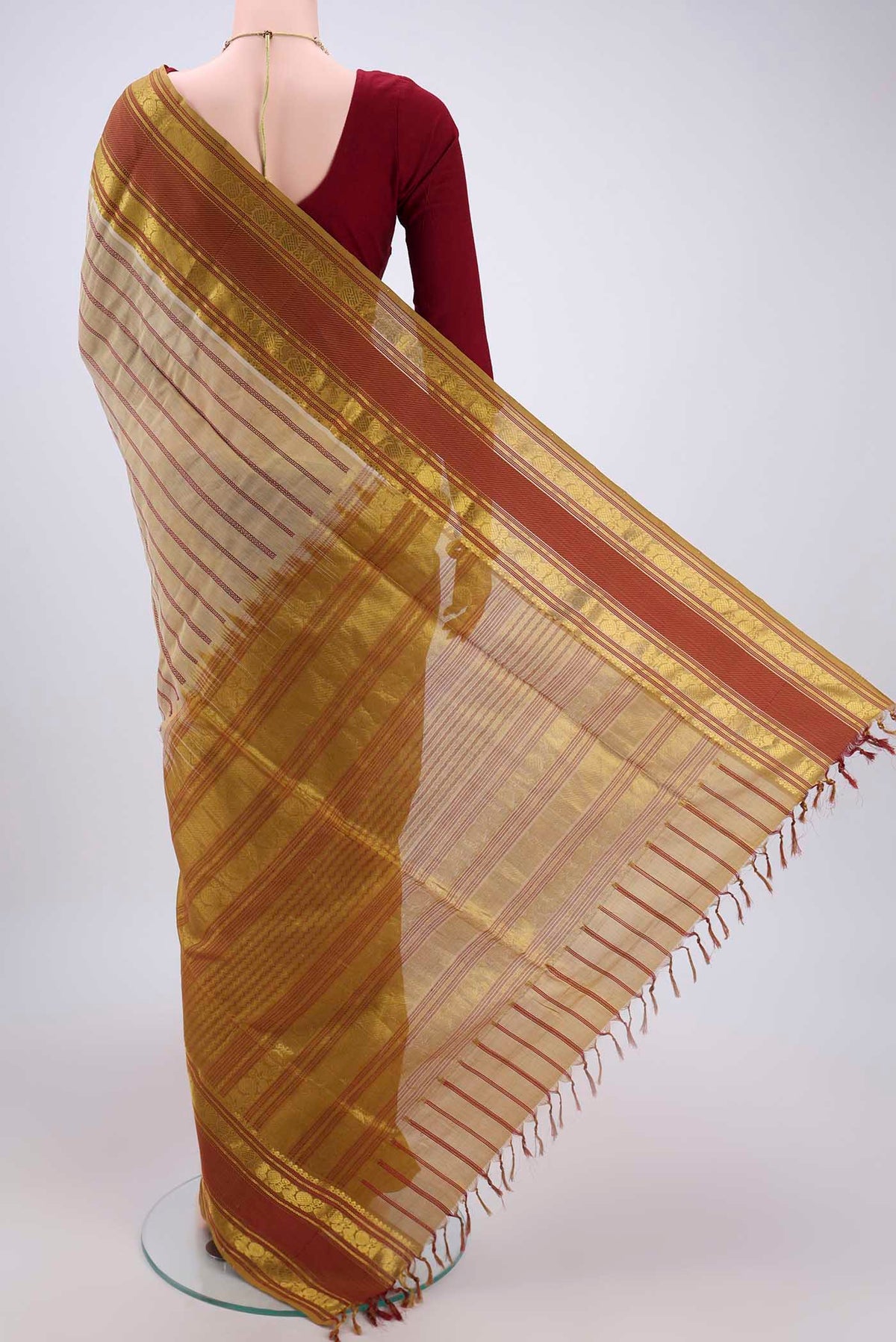 Flat view of Beige Silk Cotton Saree with Veldhari on the body and Zari And Thread Border. 