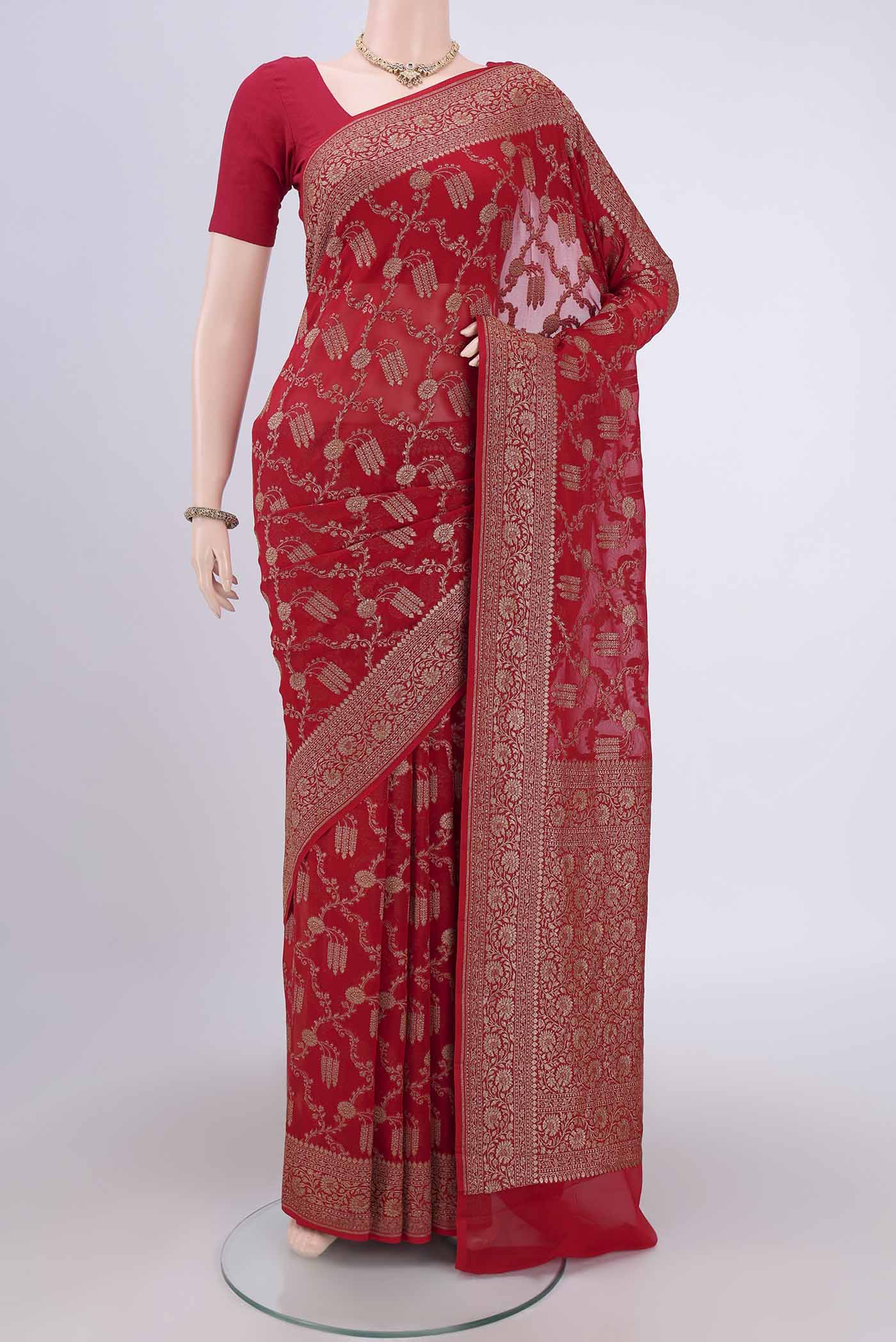 Red Banarasi Georgette Saree with Zari Brocade on the body and Zari Border.  displayed on a mannequin