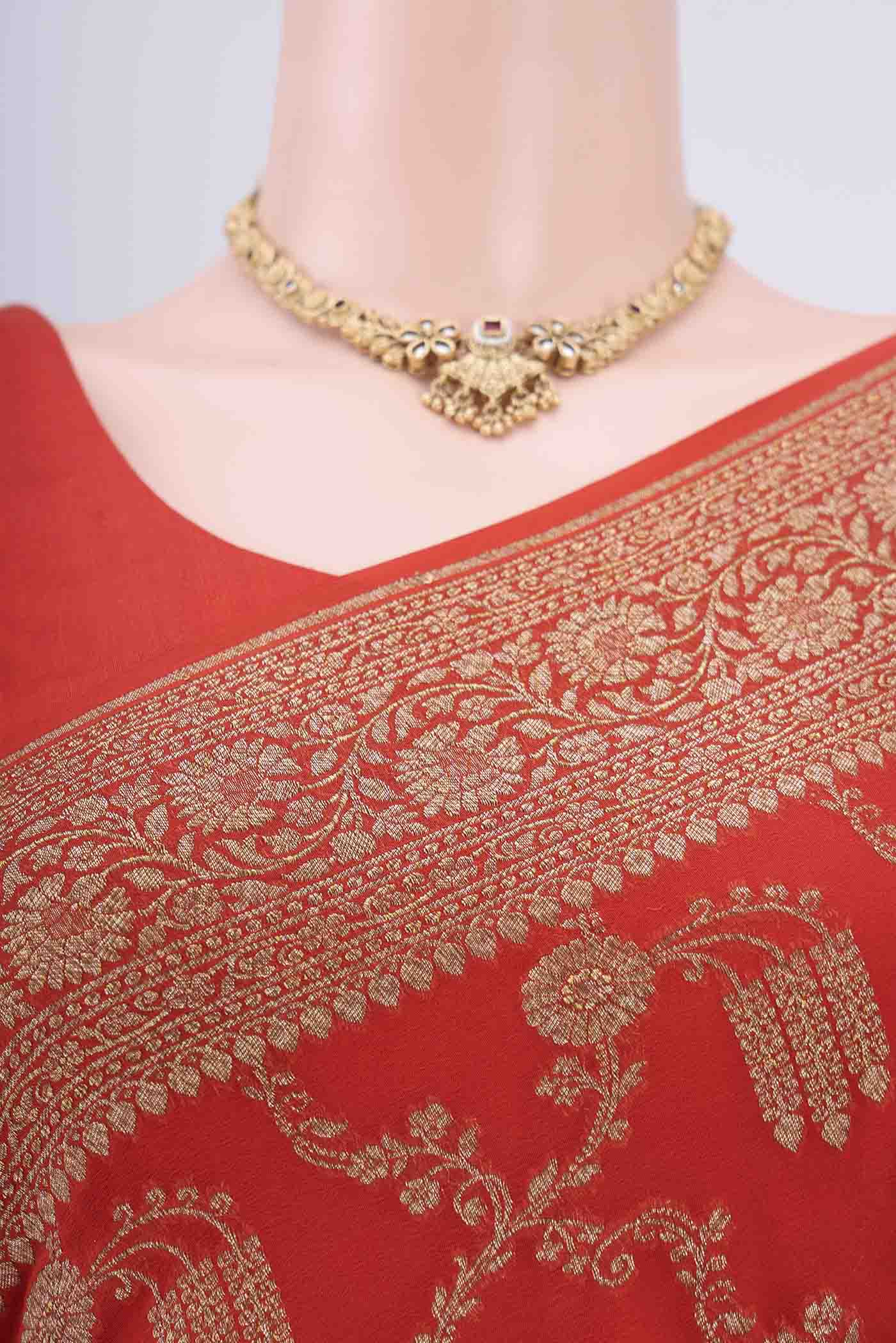 Border image of Brick Orange Banarasi Georgette Saree with Zari Brocade on the body and Zari Border. 