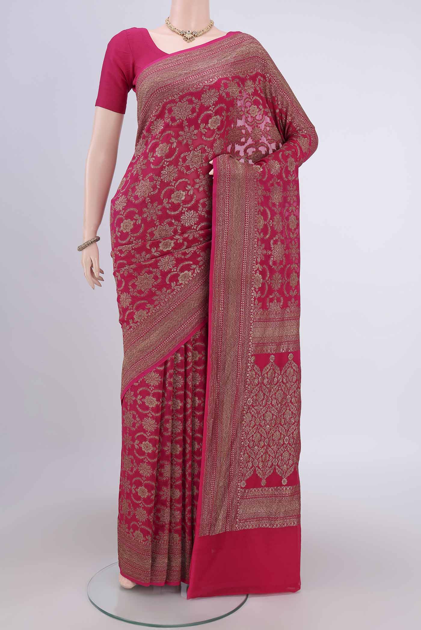 Rani Pink Banarasi Georgette Saree with Zari Brocade on the body and Zari Border.  displayed on a mannequin