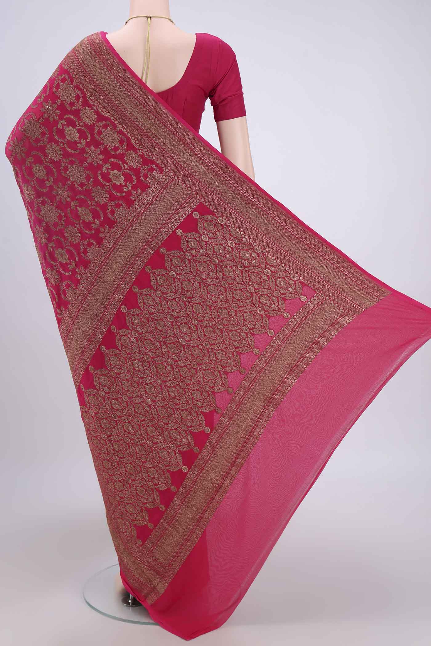Flat view of Rani Pink Banarasi Georgette Saree with Zari Brocade on the body and Zari Border. 