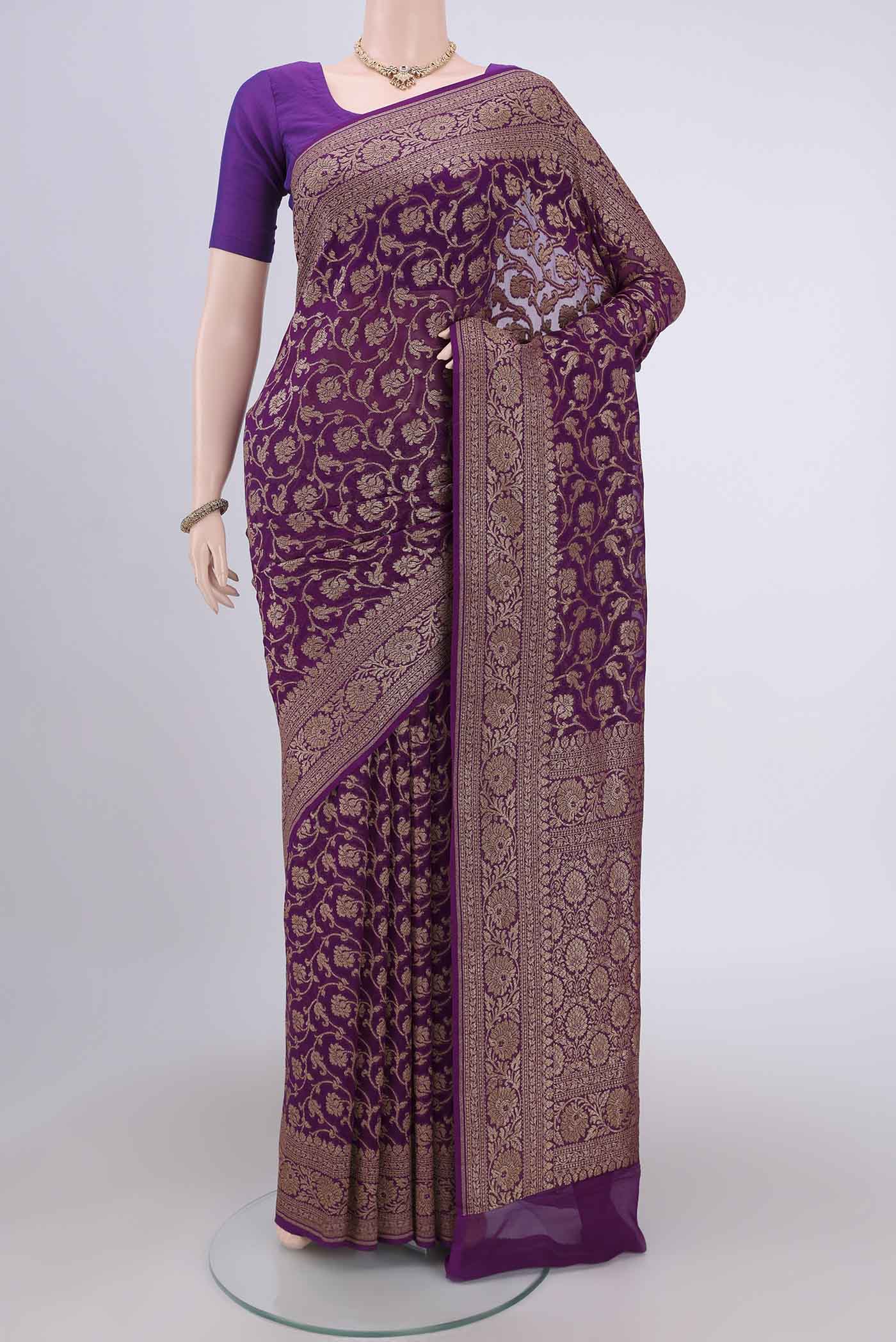 Purple Banarasi Georgette Saree with Zari Brocade on the body and Zari Border.  displayed on a mannequin