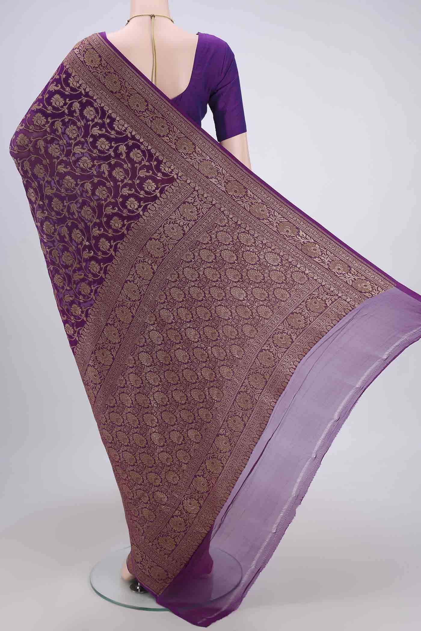 Flat view of Purple Banarasi Georgette Saree with Zari Brocade on the body and Zari Border. 