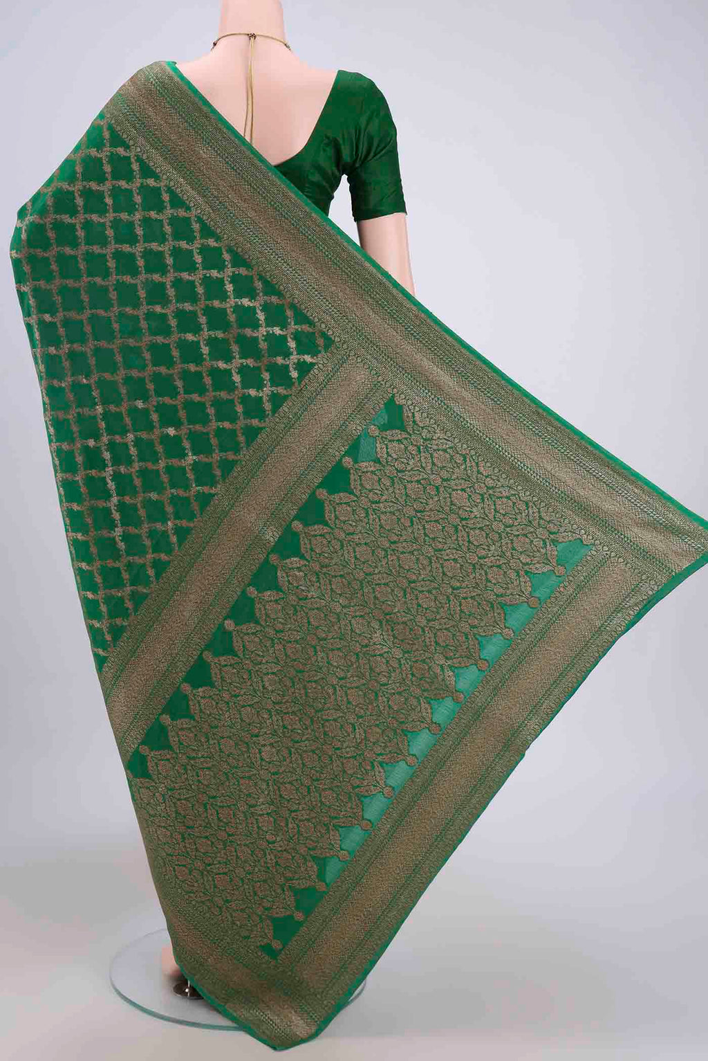 Flat view of Green Banarasi Georgette Saree with Zari Brocade on the body and Zari Border. 