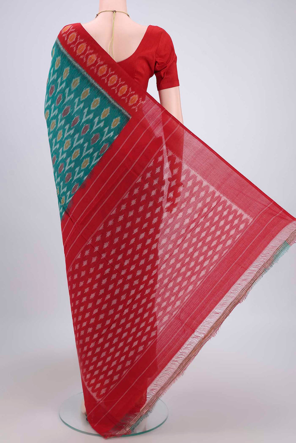 Flat view of Sea Green Pochampally Cotton Saree with Ikat design on the body and Ikat Border. 