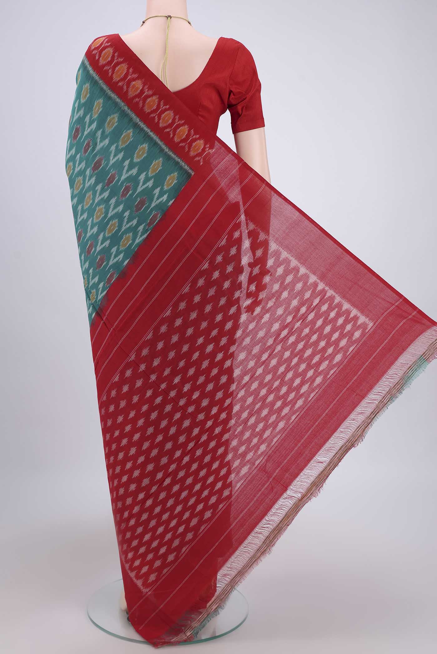 Flat view of Sea Green Pochampally Cotton Saree with Ikat design on the body and Ikat Border. 