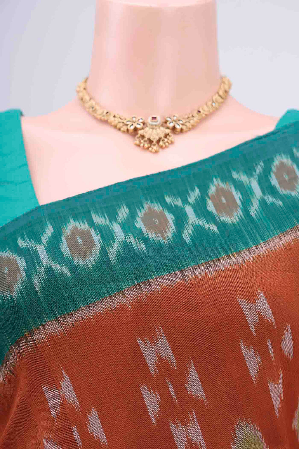Border image of Rust Pochampally Cotton Saree with Ikat design on the body and Ikat Border. 