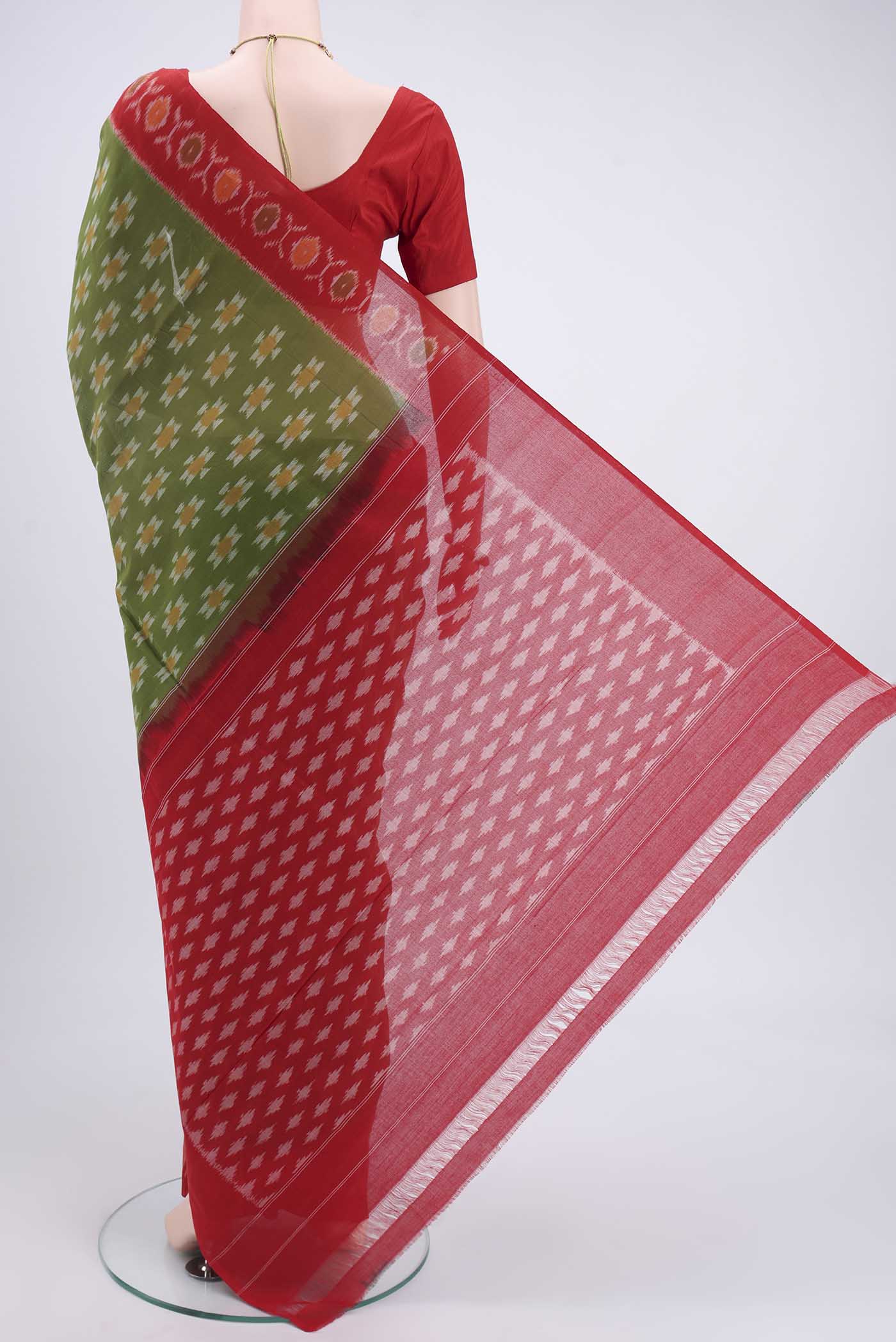 Flat view of Light Green Pochampally Cotton Saree with Ikat design on the body and Ikat Border. 
