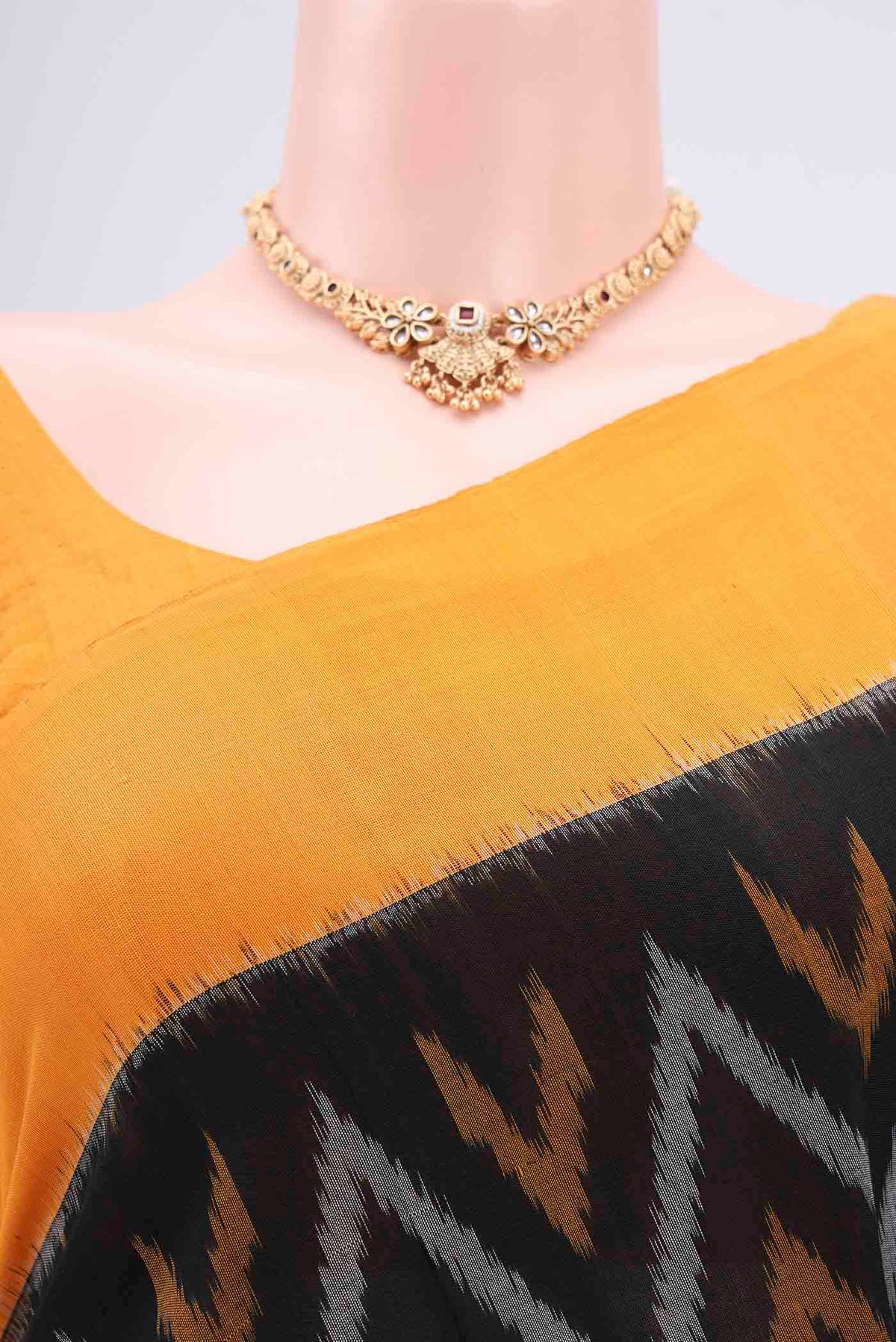 Border image of Black Pochampally Cotton Saree with Ikat design on the body and Ikat Border. 