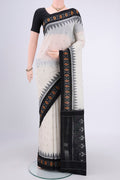 Off White Dual Tone Pochampally Cotton Saree with Ikat design on the body and Ikat Border.  displayed on a mannequin