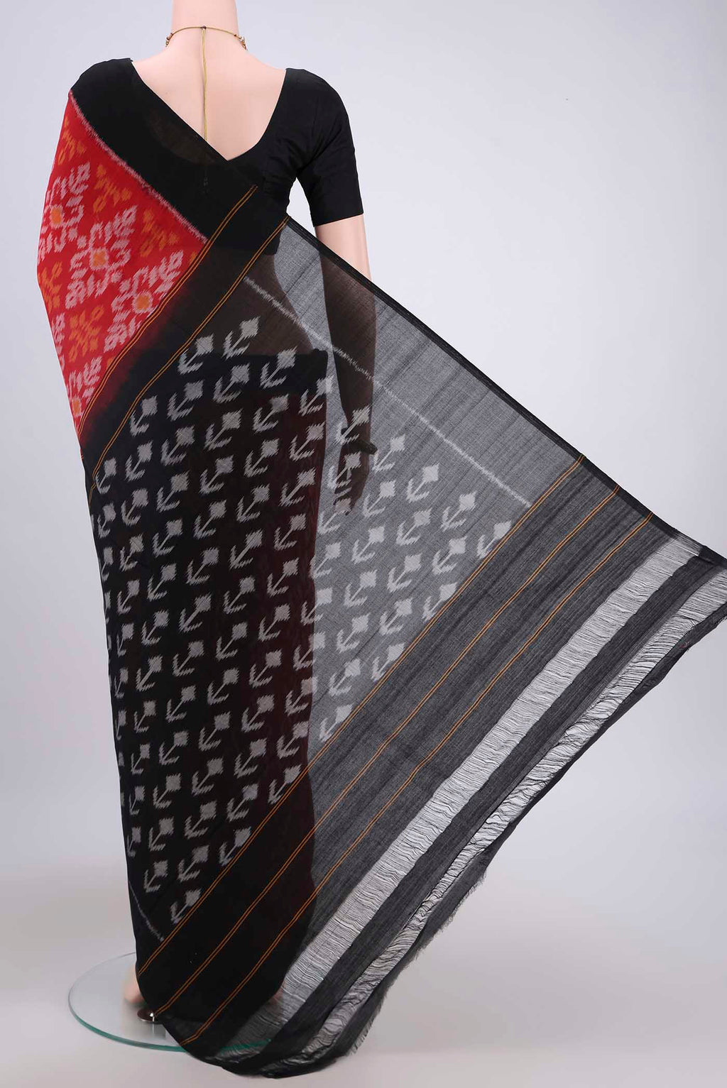 Flat view of Red Pochampally Cotton Saree with Ikat design on the body and Ikat Border. 