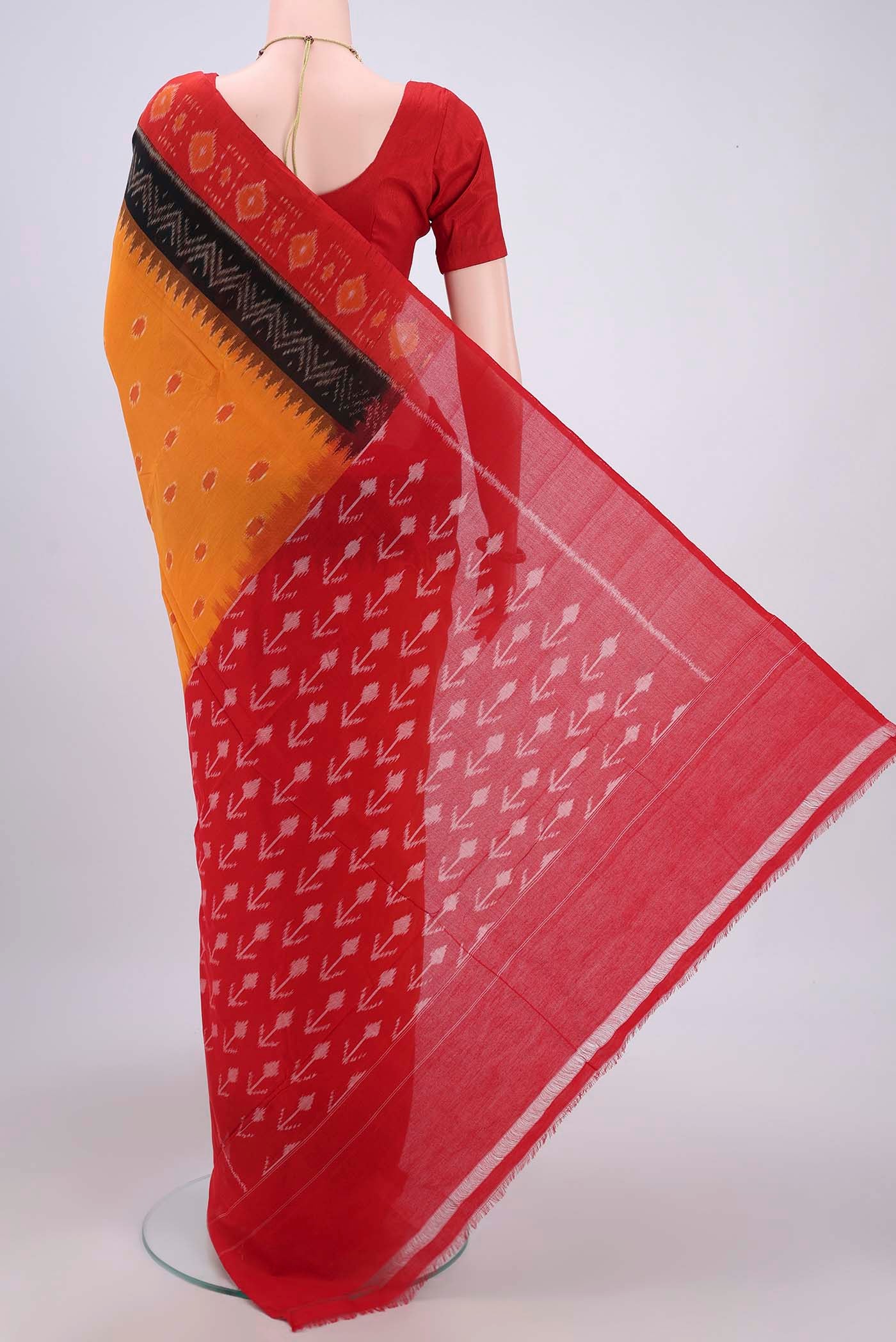 Flat view of Mustard Pochampally Cotton Saree with Ikat design on the body and Ikat Border. 