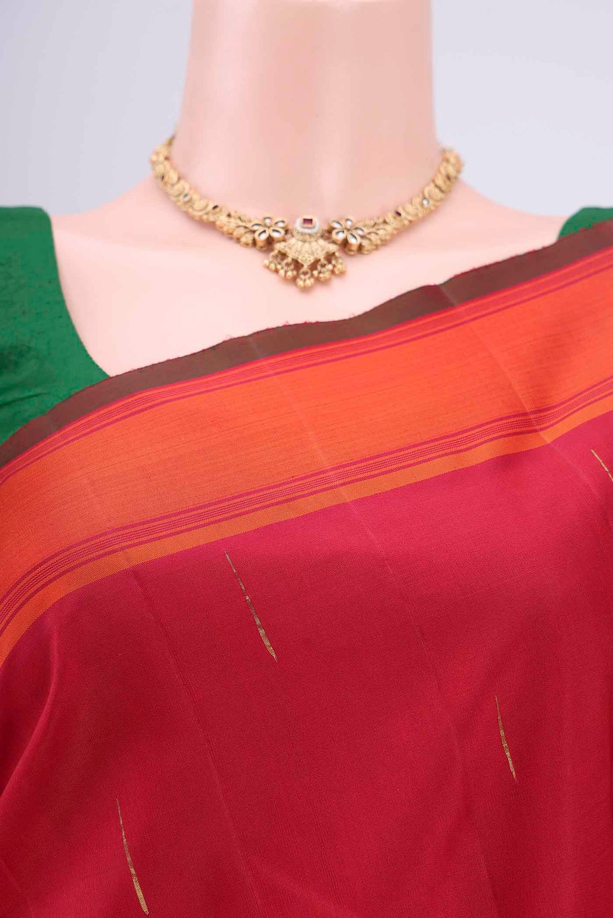 Border image of Maroon Dual Tone Kanjivaram Silk Saree with Zari Butta on the body and Plain Border. 