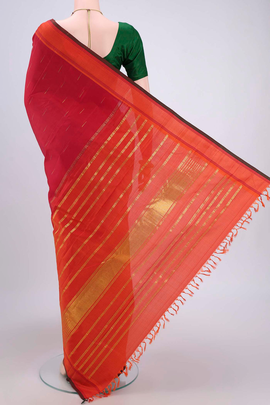 Flat view of Maroon Dual Tone Kanjivaram Silk Saree with Zari Butta on the body and Plain Border. 