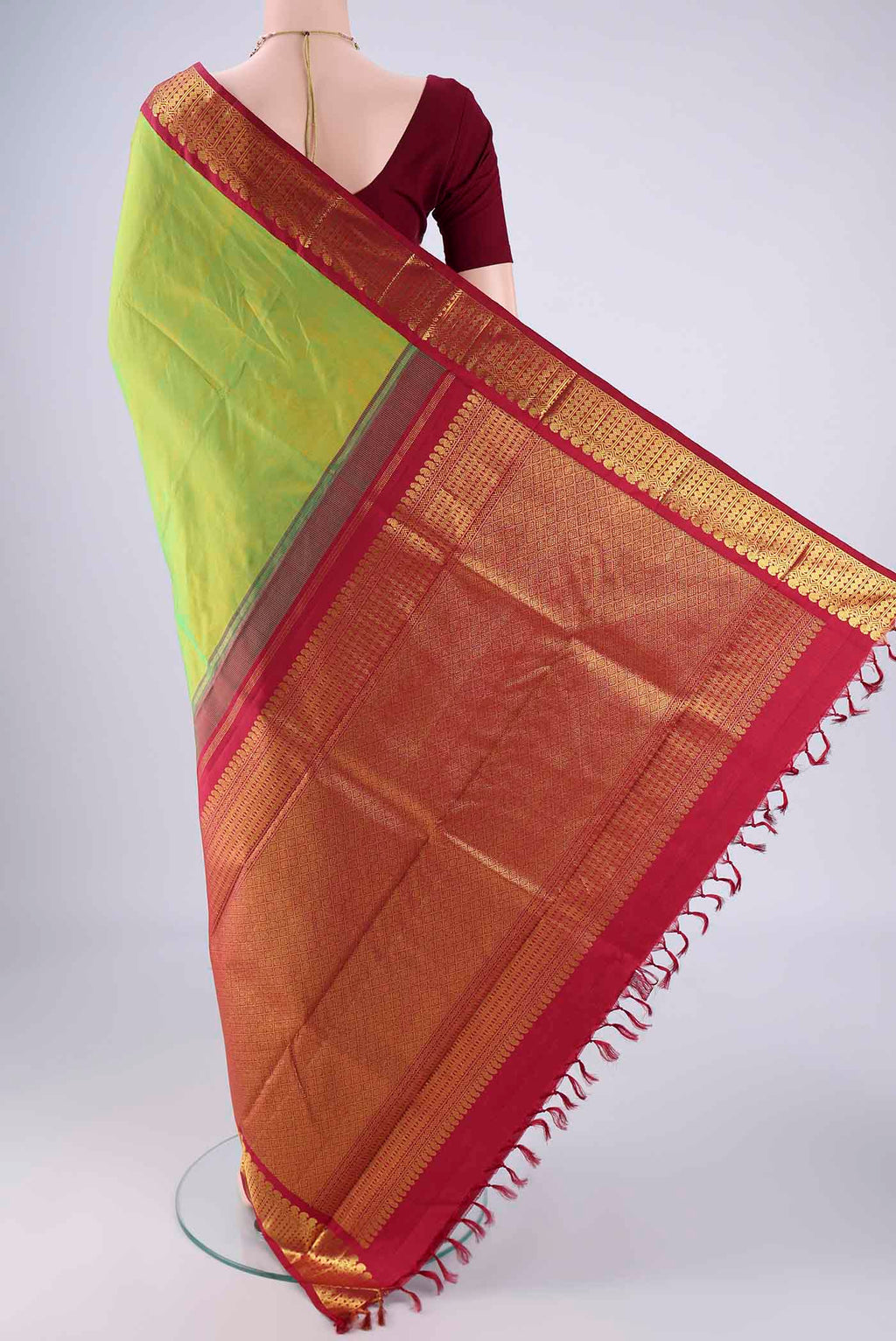 Flat view of Light Green Kanjivaram Silk Saree with Plain Body and Zari Border. 