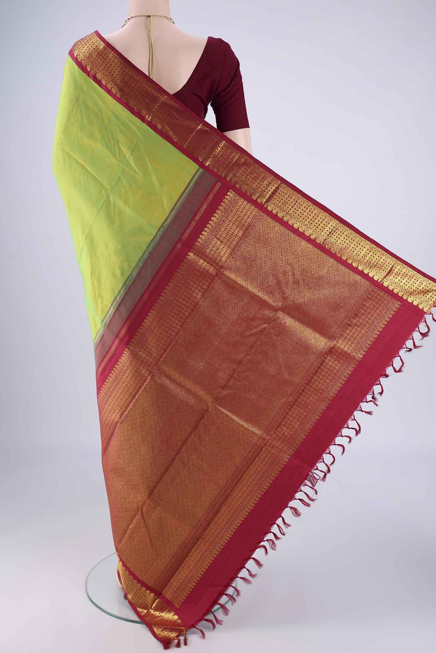 Flat view of Light Green Kanjivaram Silk Saree with Plain Body and Zari Border. 