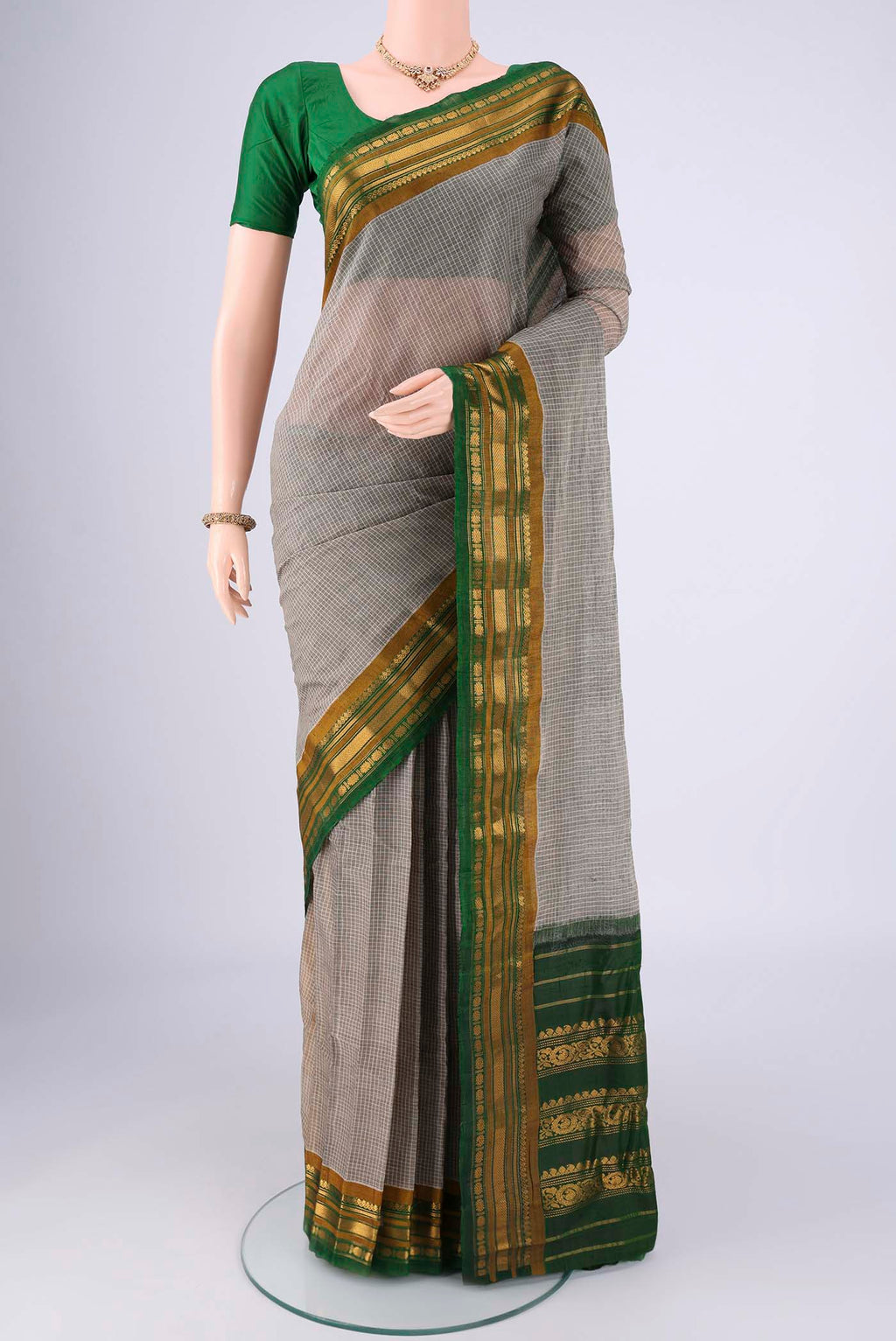 Grey Gadwal cotton Saree with Checked design on the body and Zari Border.  displayed on a mannequin